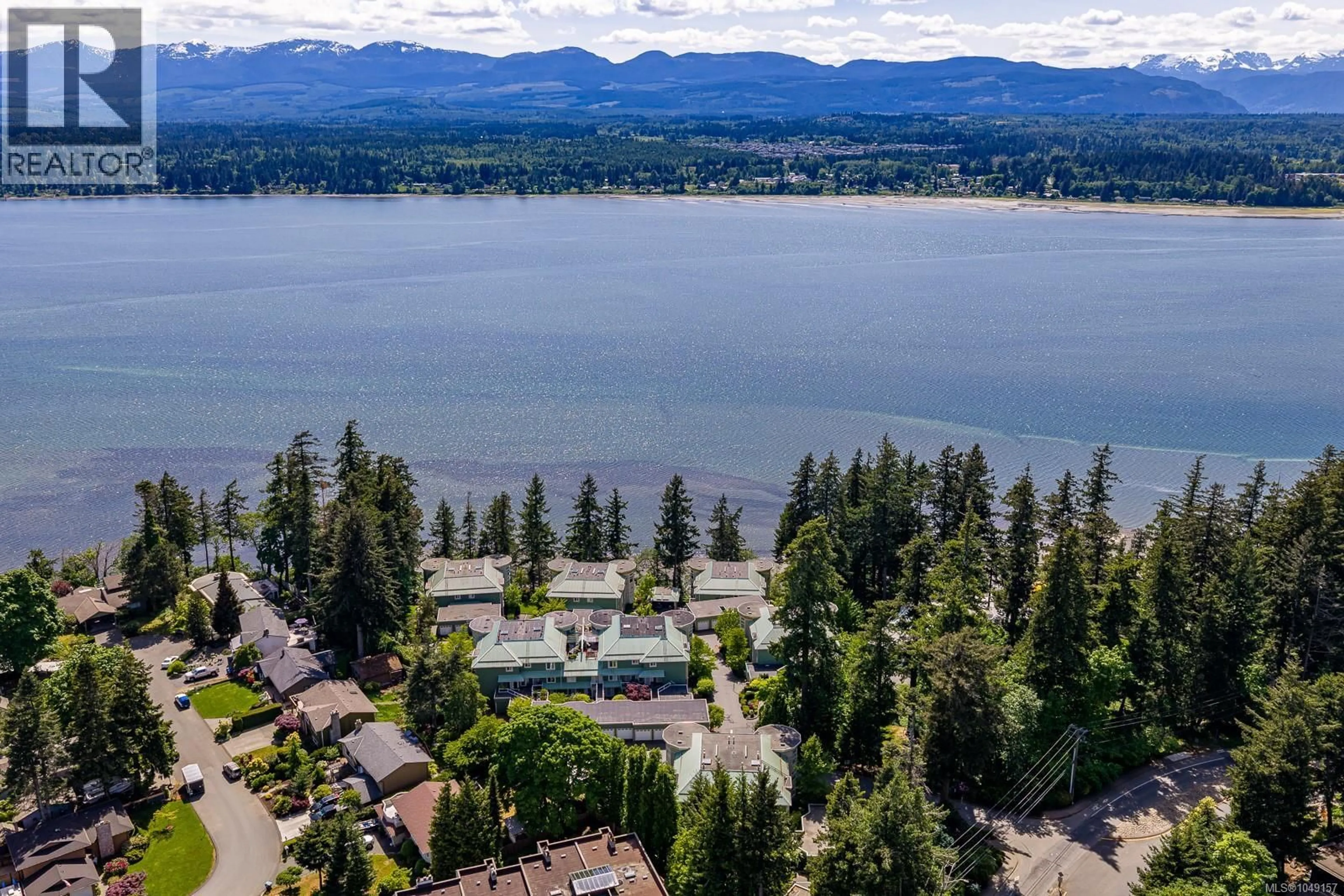 A pic from outside/outdoor area/front of a property/back of a property/a pic from drone, water/lake/river/ocean view for 202 - 2275 COMOX AVENUE, Comox British Columbia V9M1X6