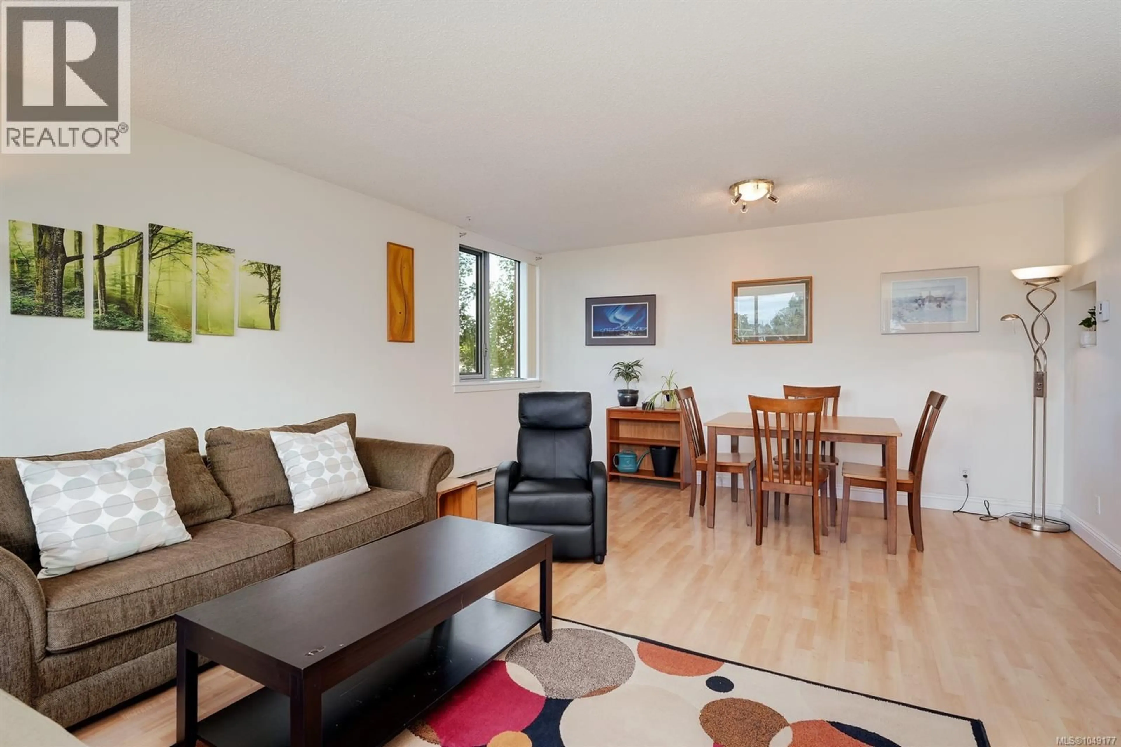 Living room with furniture, wood/laminate floor for 501 - 327 MAITLAND STREET, Victoria British Columbia V9A7G7