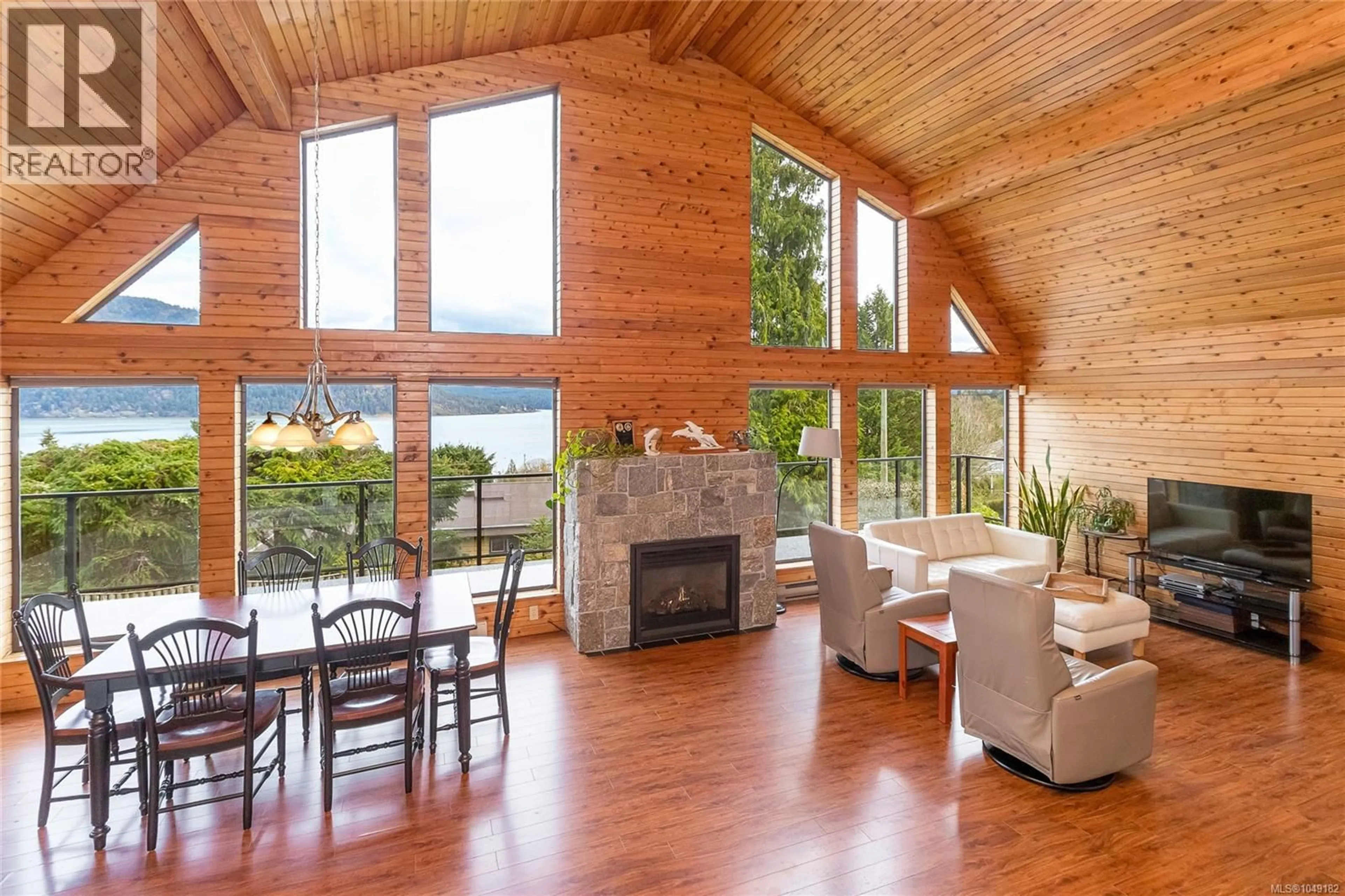 Living room with furniture, wood/laminate floor for 1766 PRITCHARD ROAD, Cowichan Bay British Columbia V0R1N1