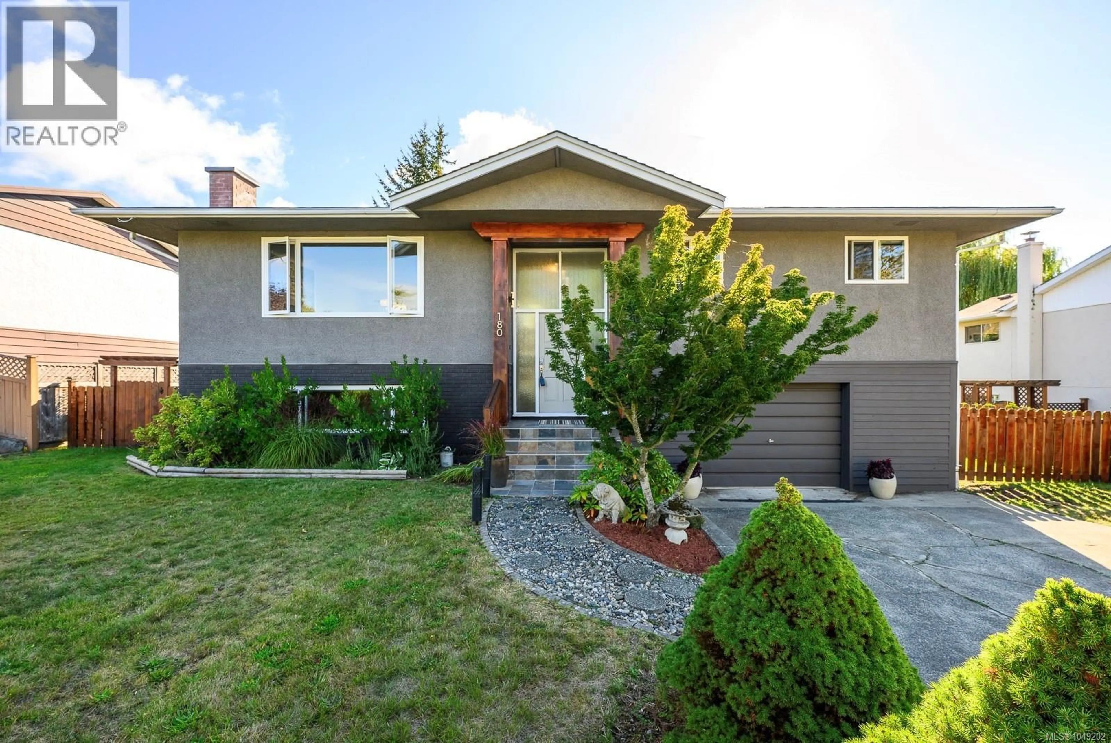 Home with vinyl exterior material, street for 180 BEACH DRIVE, Comox British Columbia V9M1T6