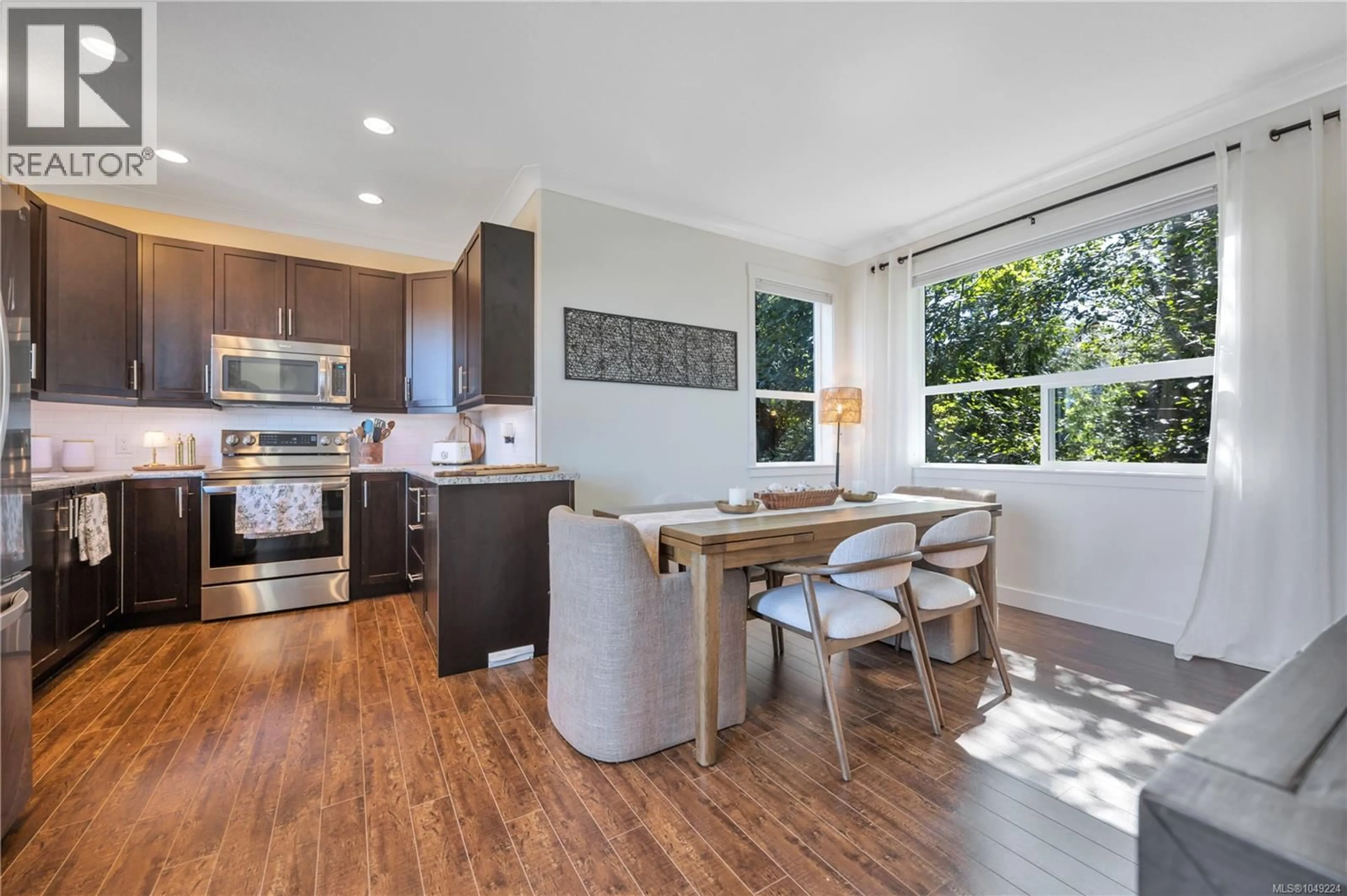 Open concept kitchen, wood/laminate floor for 2 - 6119 GLACIER WAY, Nanaimo British Columbia V9T0H8