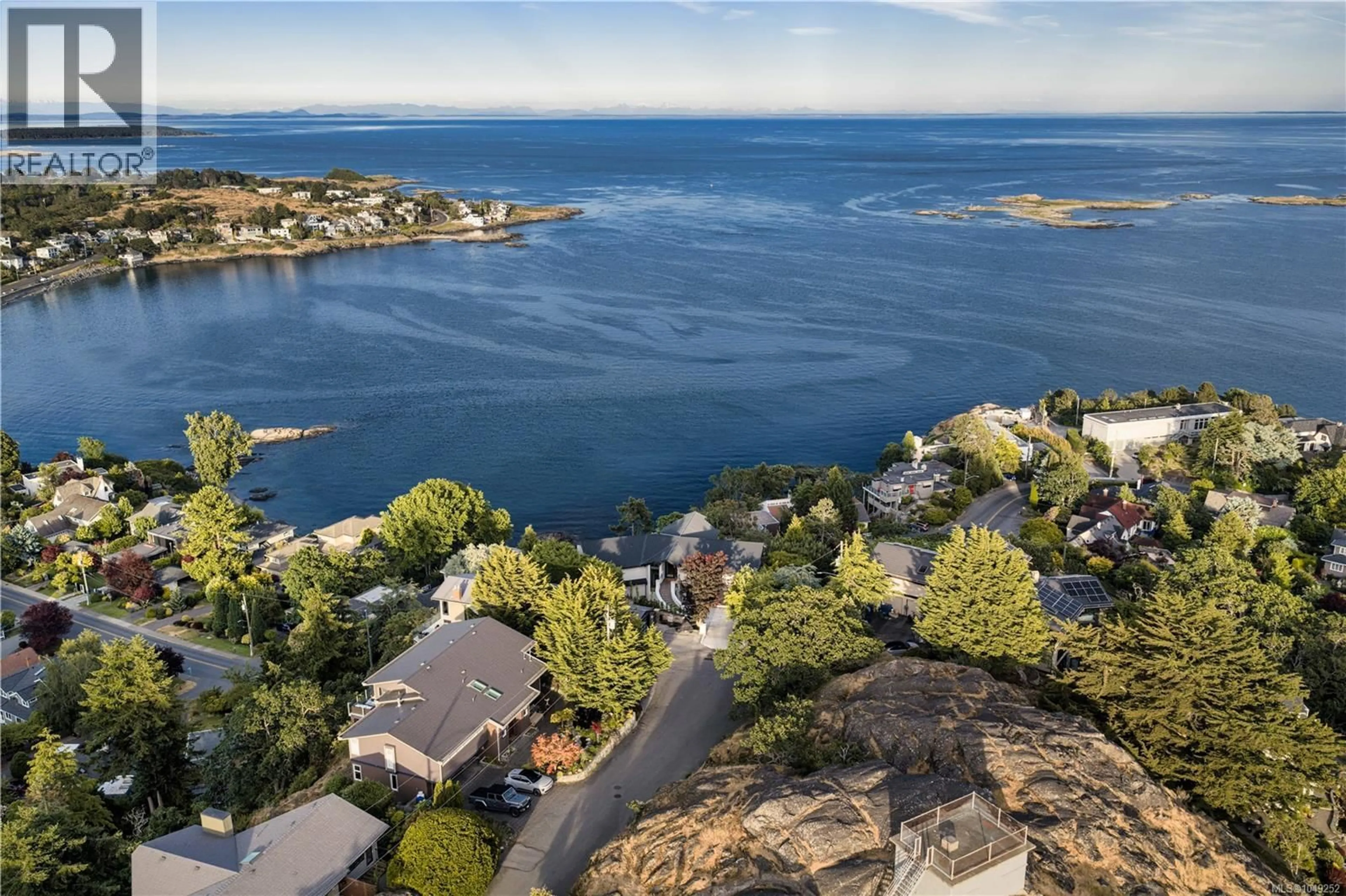 A pic from outside/outdoor area/front of a property/back of a property/a pic from drone, water/lake/river/ocean view for 121 DENISON ROAD, Oak Bay British Columbia V8S2K2