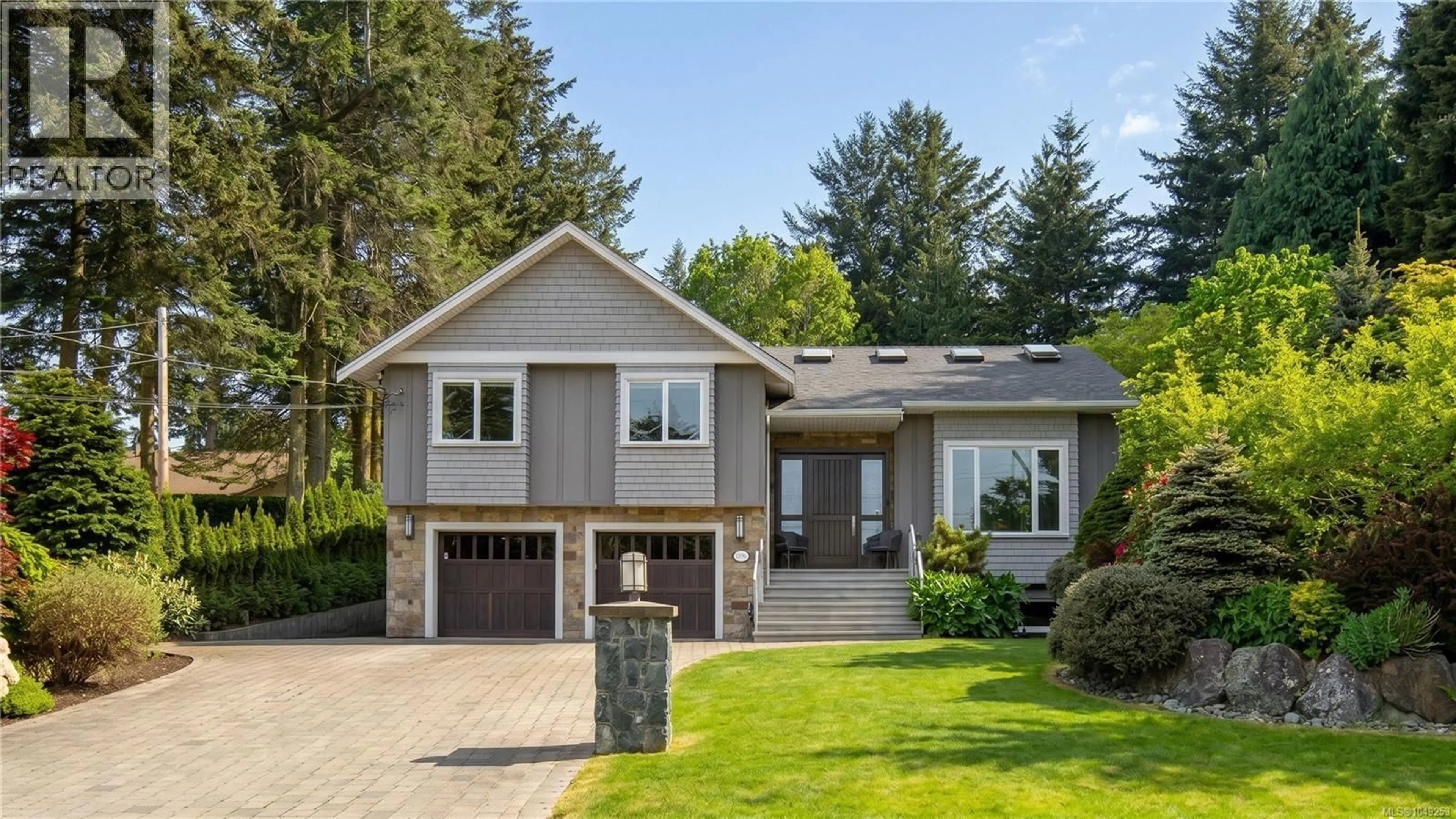 Home with vinyl exterior material, street for 1896 LEYNS ROAD, Saanich British Columbia V8N2Z8