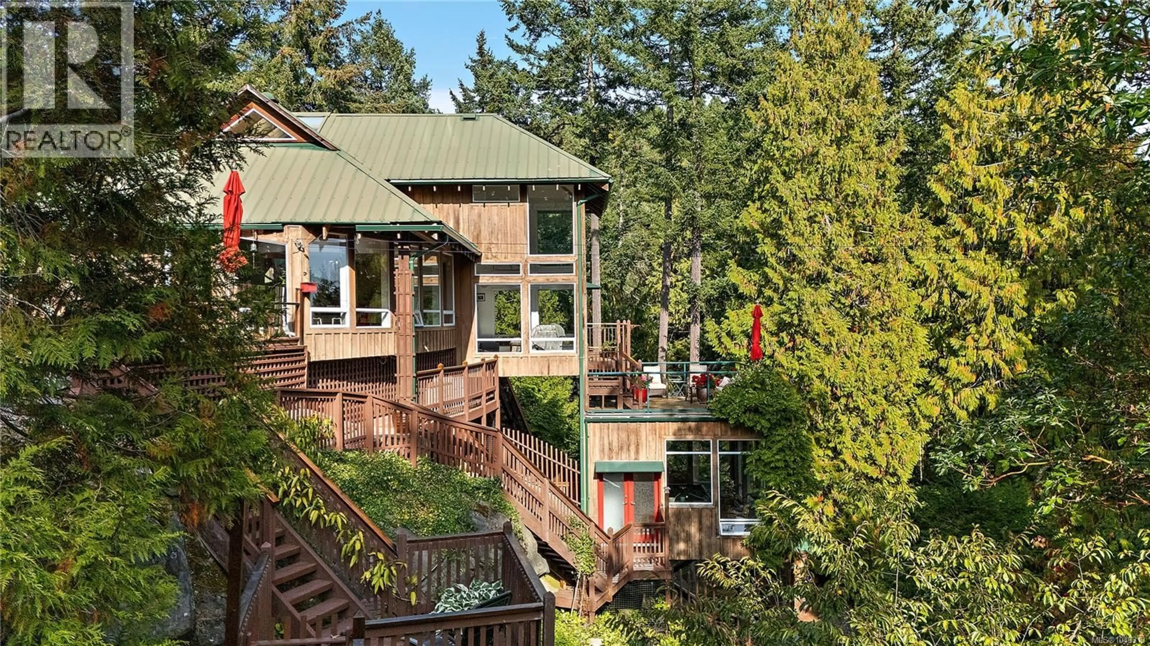 A pic from outside/outdoor area/front of a property/back of a property/a pic from drone, forest/trees view for 486 BLUFF WAY, Mayne Island British Columbia V0N2J2