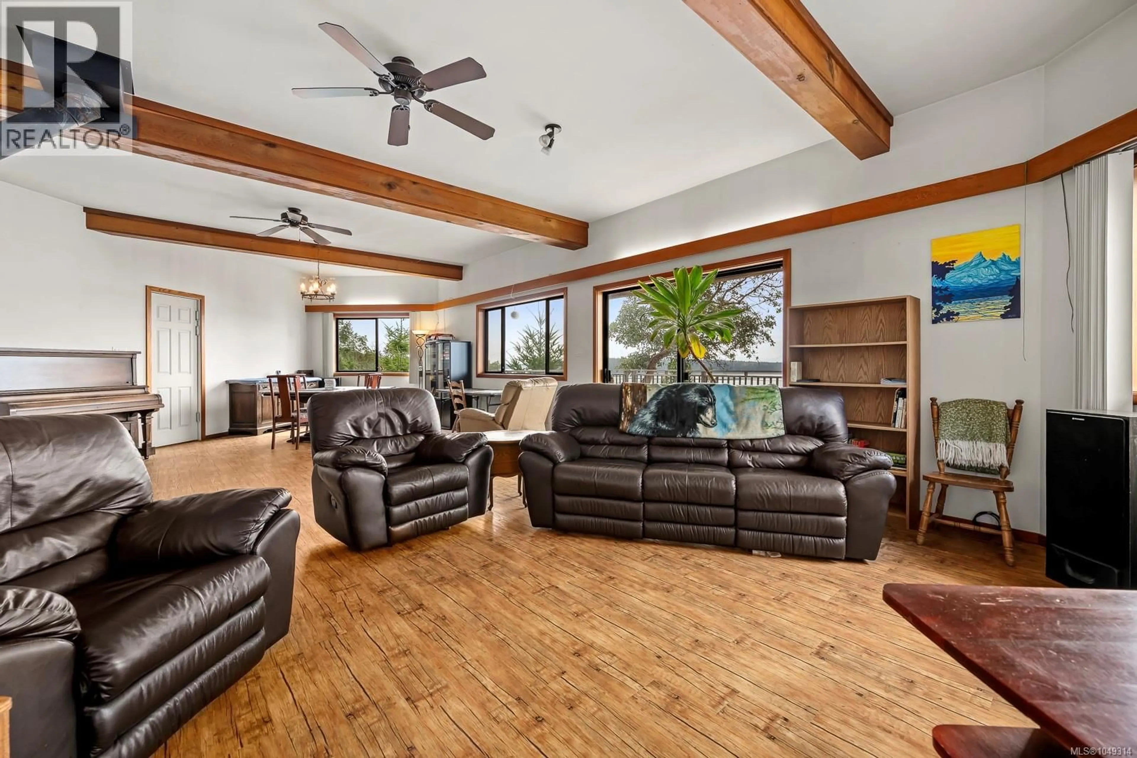 Living room with furniture, wood/laminate floor for 1466 NORTON DRIVE, Cortes Island British Columbia V0P1Z0