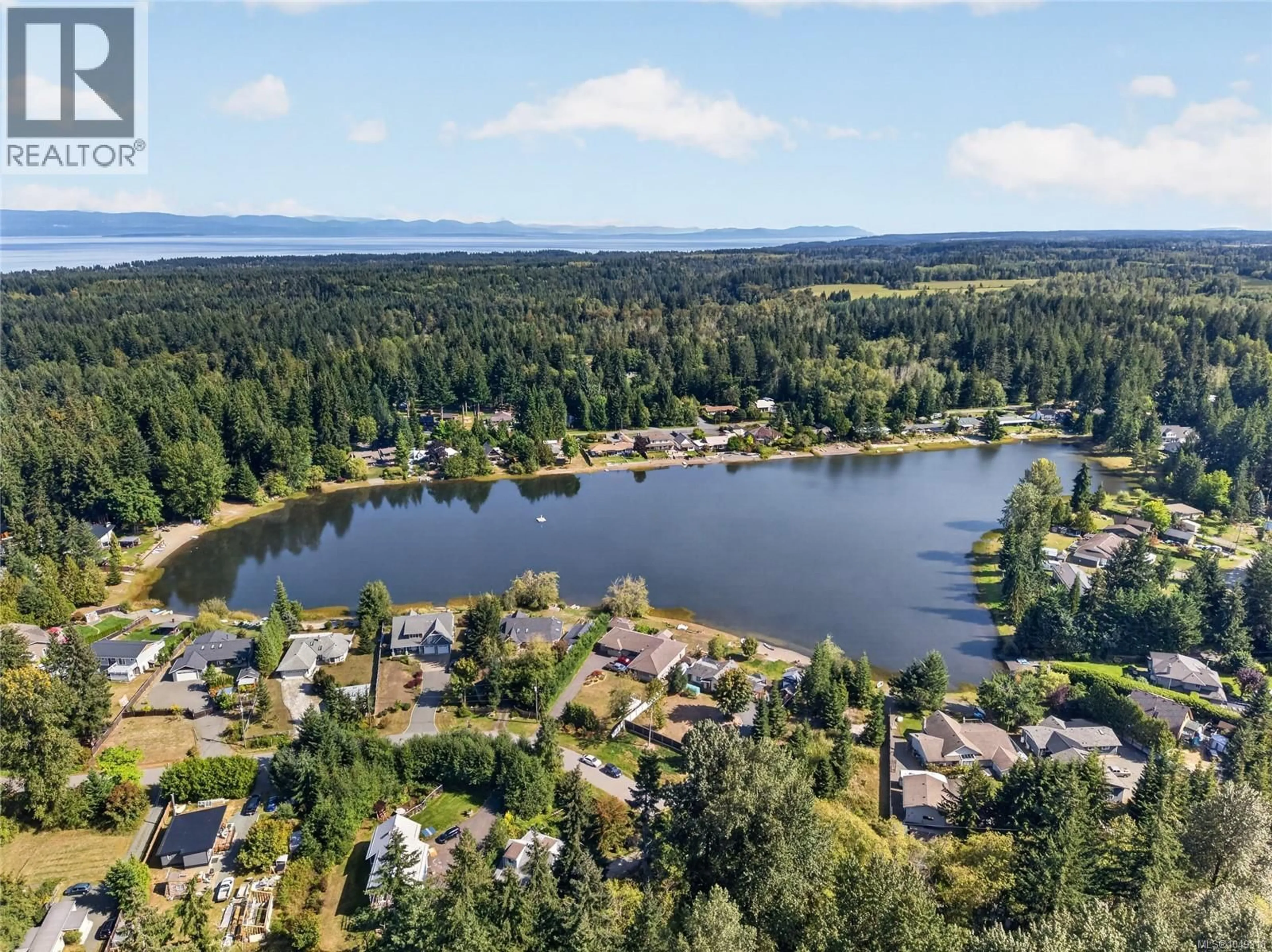 A pic from outside/outdoor area/front of a property/back of a property/a pic from drone, water/lake/river/ocean view for 9484 MARTIN PARK DRIVE, Black Creek British Columbia V9J1C4