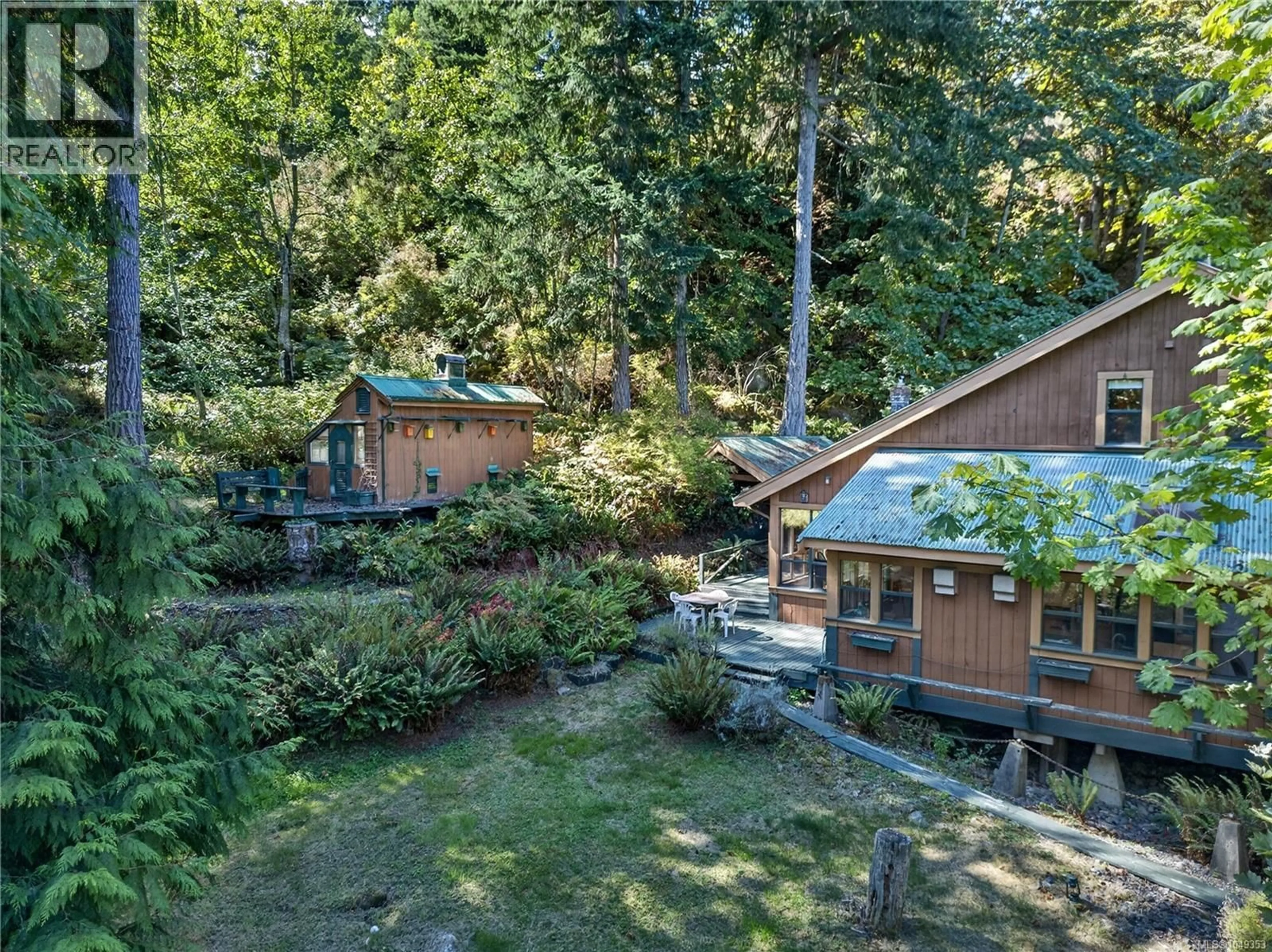 A pic from outside/outdoor area/front of a property/back of a property/a pic from drone, forest/trees view for 521 BEDDIS ROAD, Salt Spring British Columbia V8K2E8