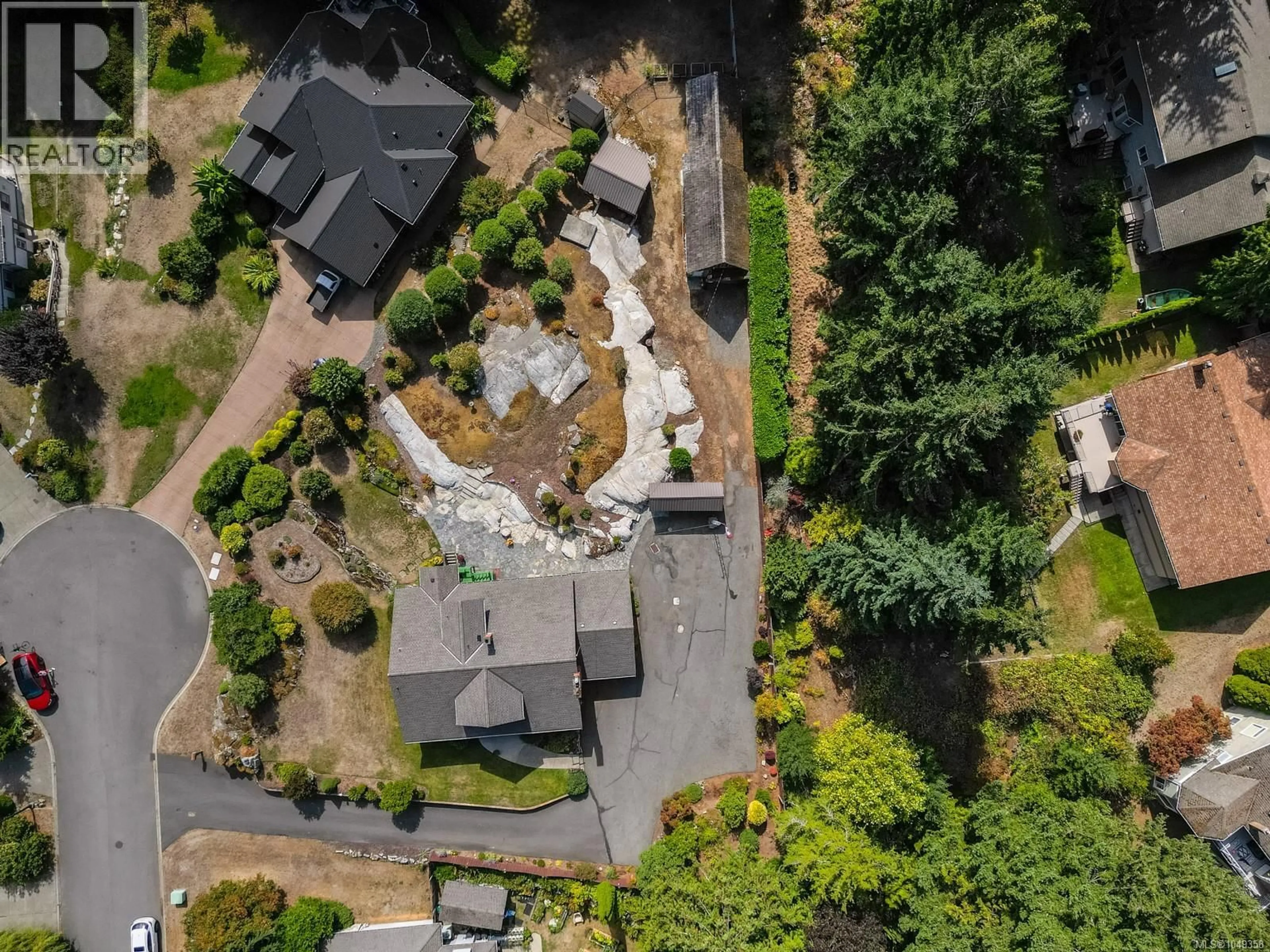 A pic from outside/outdoor area/front of a property/back of a property/a pic from drone, street for 8620 FOREST PARK PLACE, North Saanich British Columbia V8L5Z7