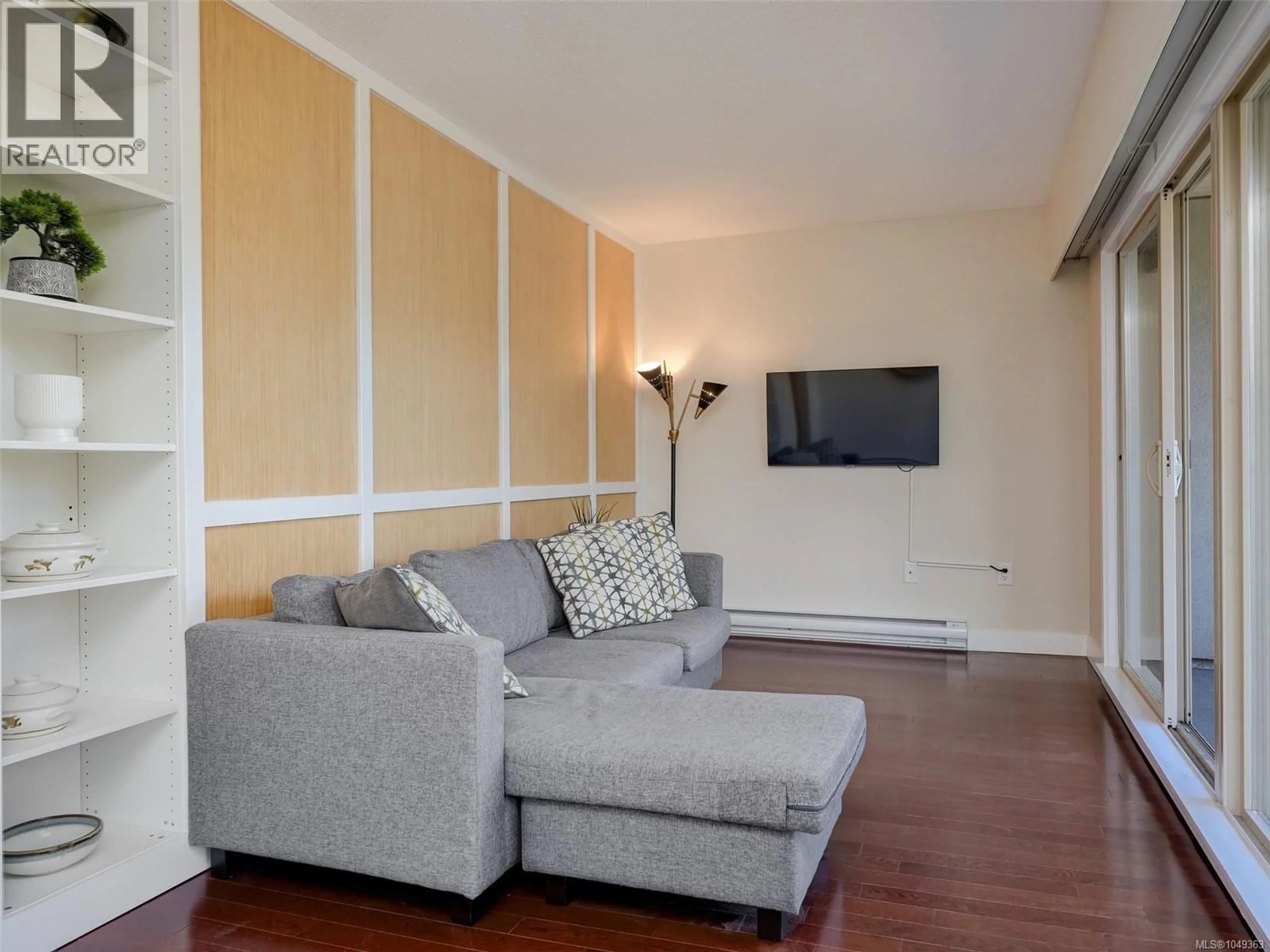 Living room with furniture, wood/laminate floor for 206 - 1545 PANDORA AVENUE, Victoria British Columbia V8R6R1