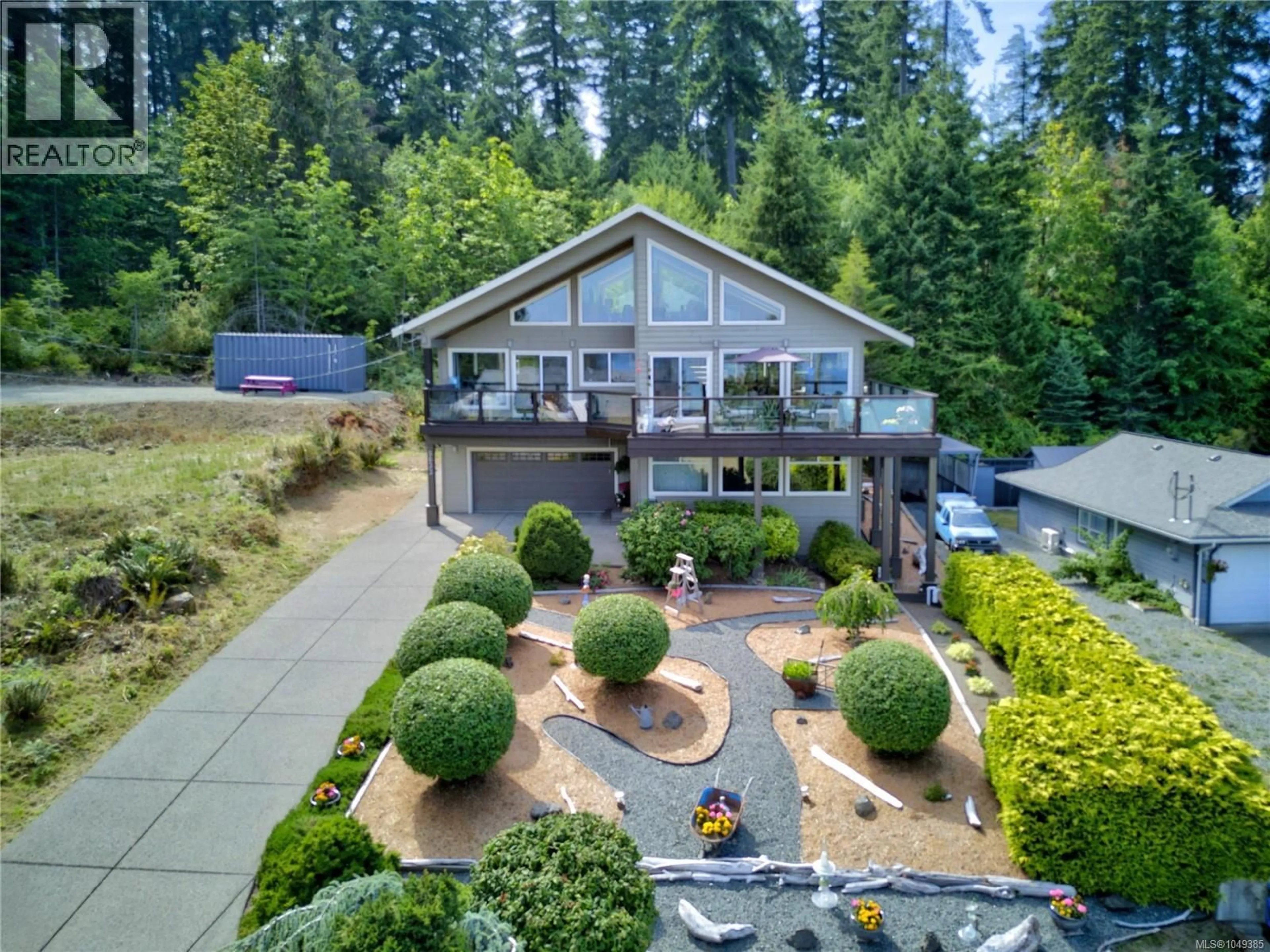 A pic from outside/outdoor area/front of a property/back of a property/a pic from drone, water/lake/river/ocean view for 5633 6TH STREET, Union Bay British Columbia V0R3B0
