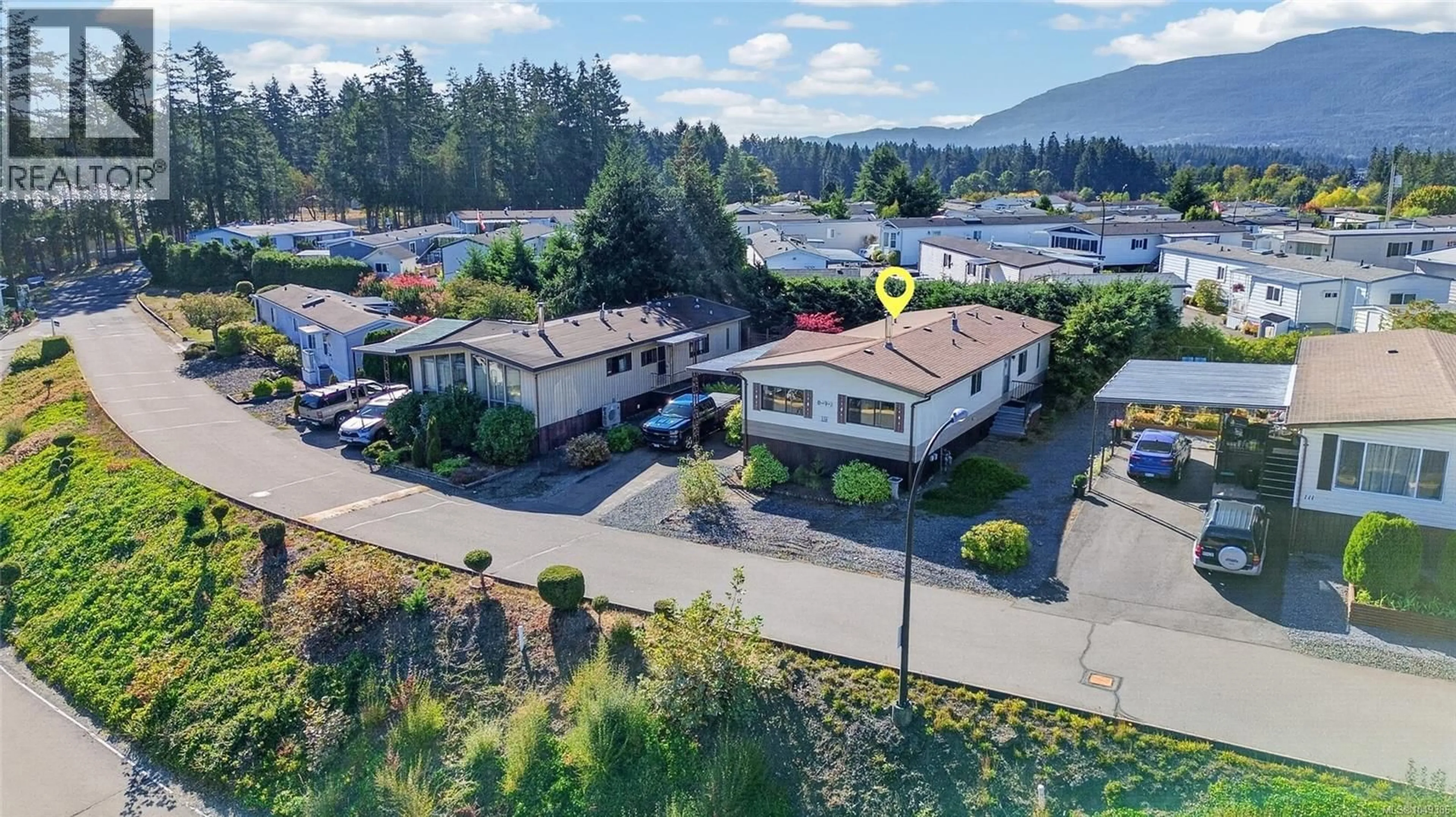 A pic from outside/outdoor area/front of a property/back of a property/a pic from drone, mountain view for 110 - 6325 METRAL DRIVE, Nanaimo British Columbia V9T6P9