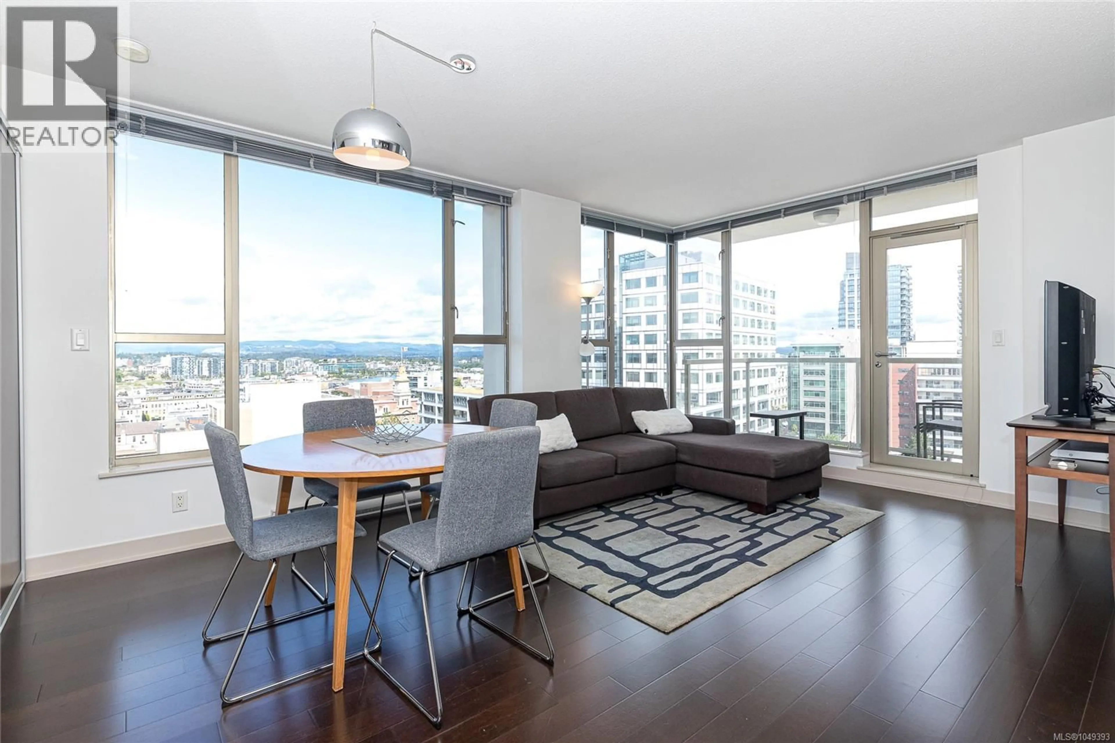 Living room with furniture, wood/laminate floor for 1204 - 760 JOHNSON STREET, Victoria British Columbia V8W0A4