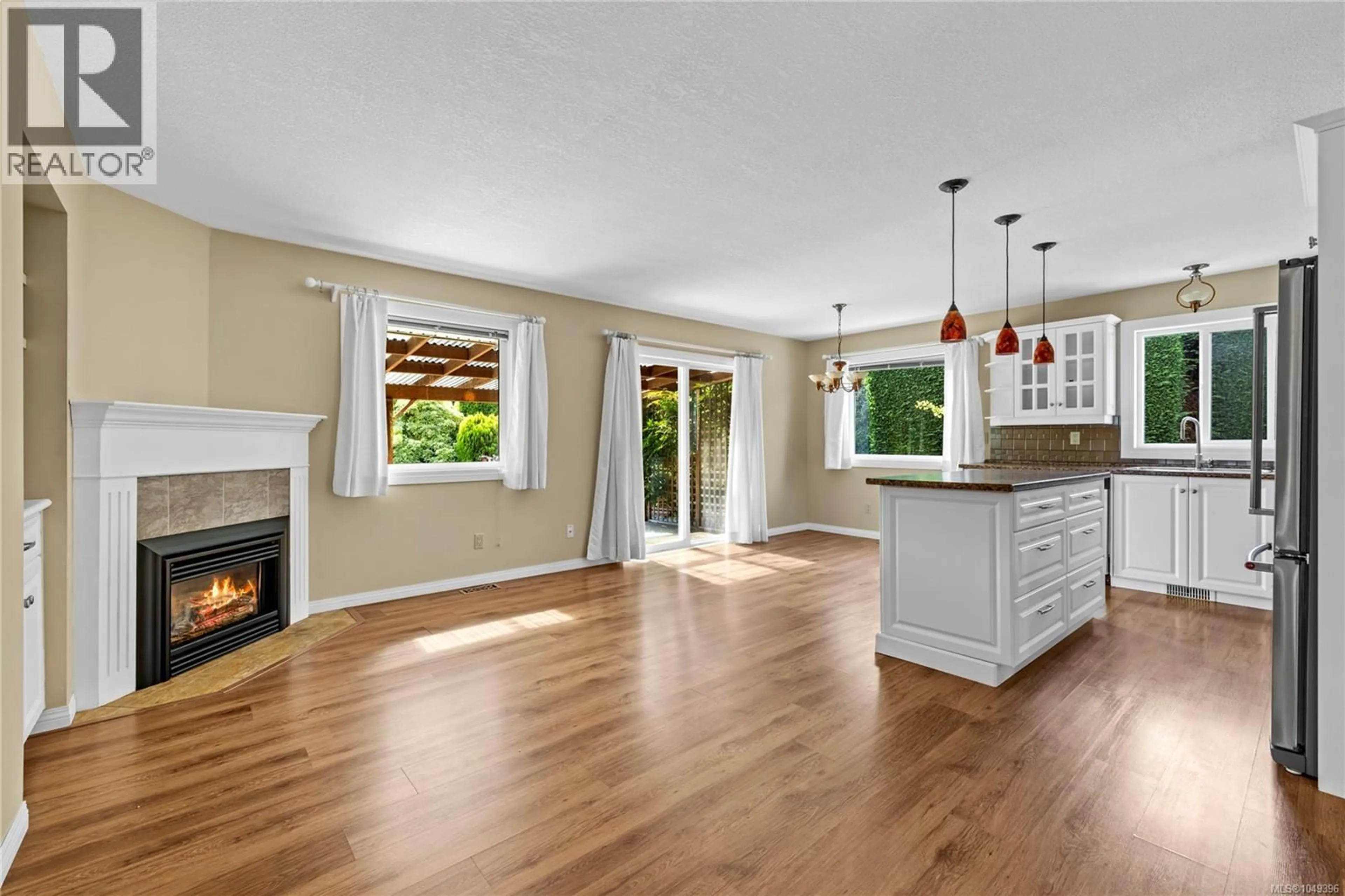 Open concept kitchen, wood/laminate floor for 662 REDWOOD DRIVE, Qualicum Beach British Columbia V9K1A2