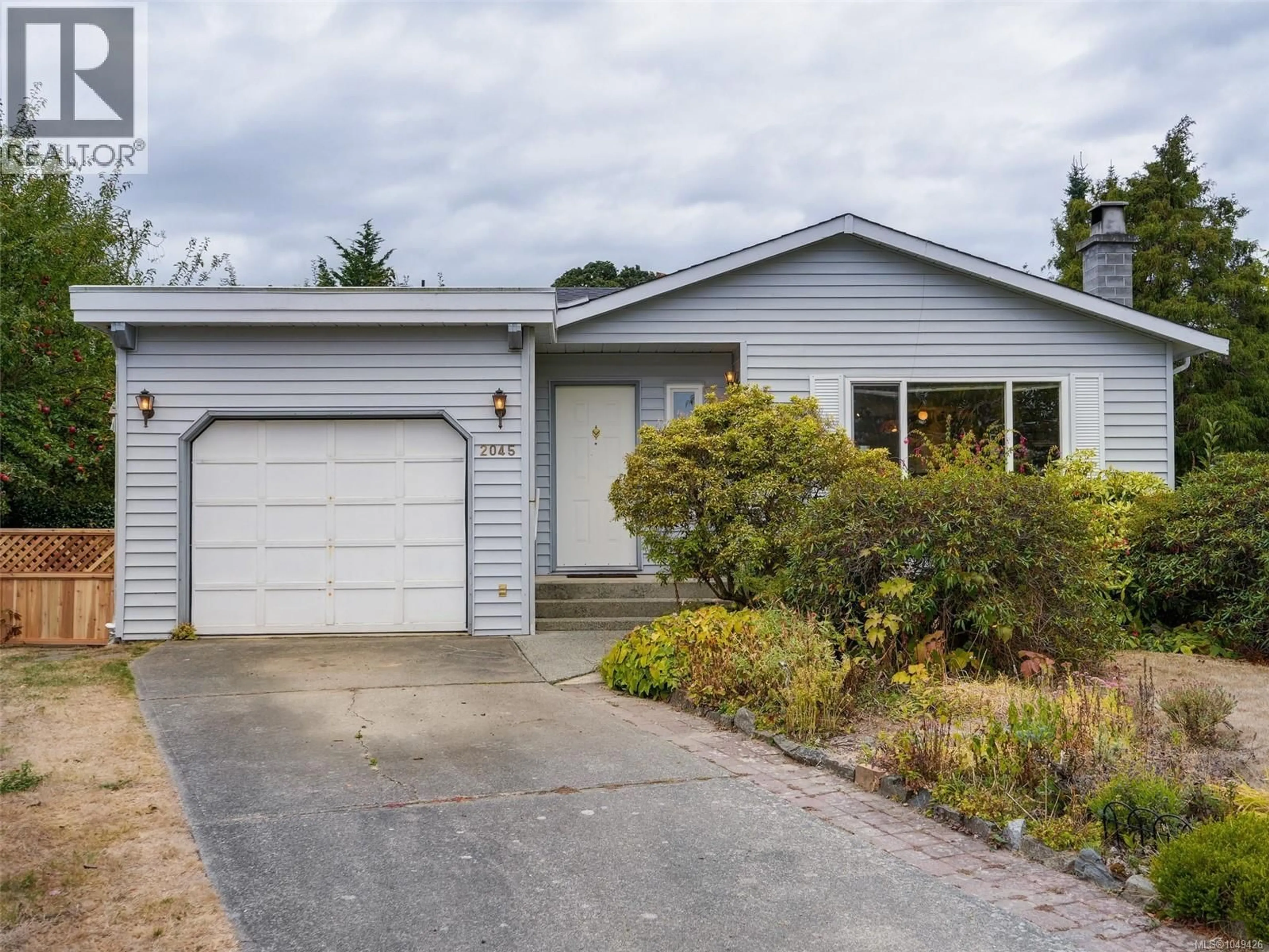 Home with vinyl exterior material, street for 2045 WINMEADOW PLACE, Sidney British Columbia V8L4S3