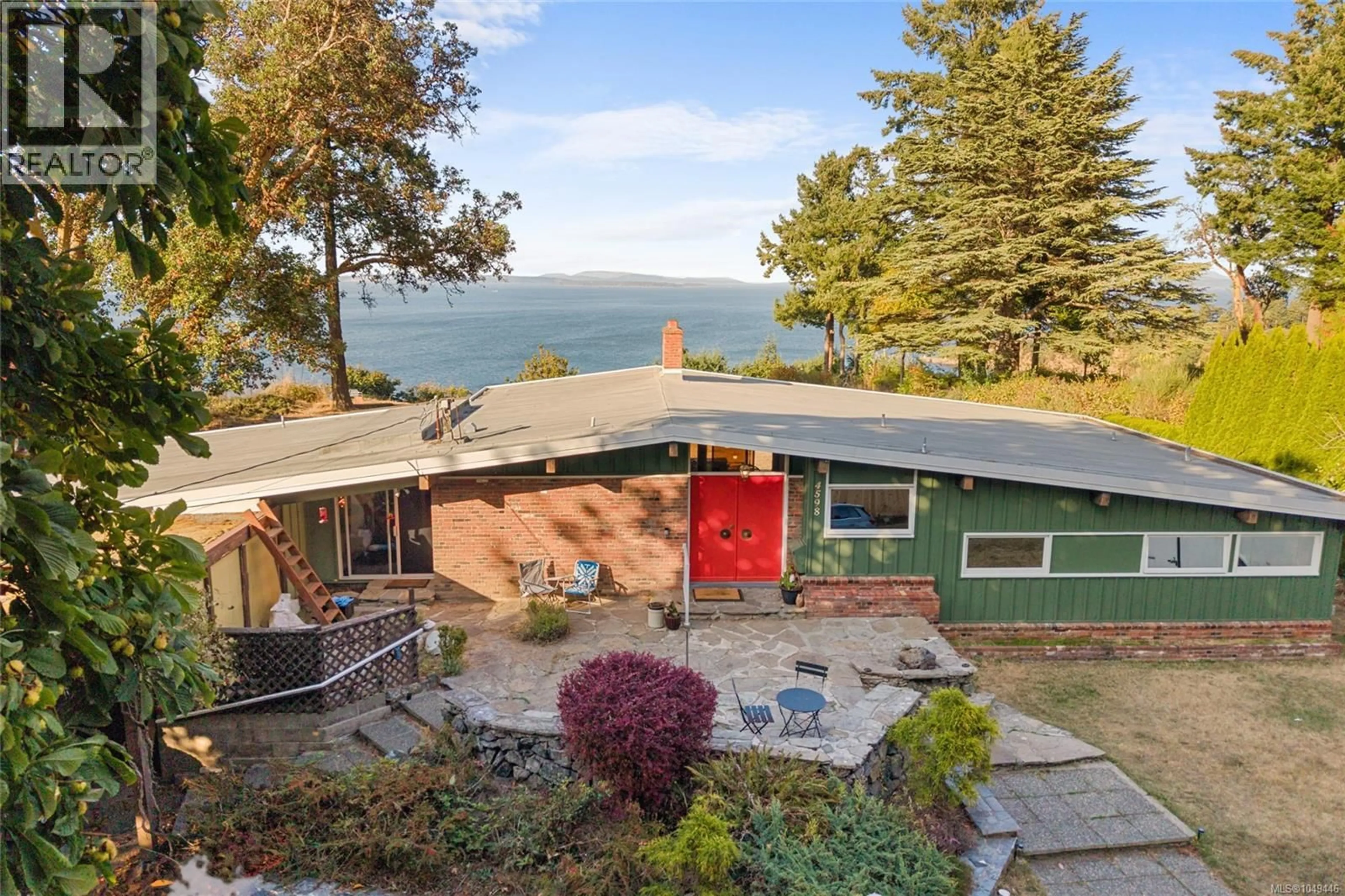 A pic from outside/outdoor area/front of a property/back of a property/a pic from drone, water/lake/river/ocean view for 4598 TORQUAY DRIVE, Saanich British Columbia V8N3L7