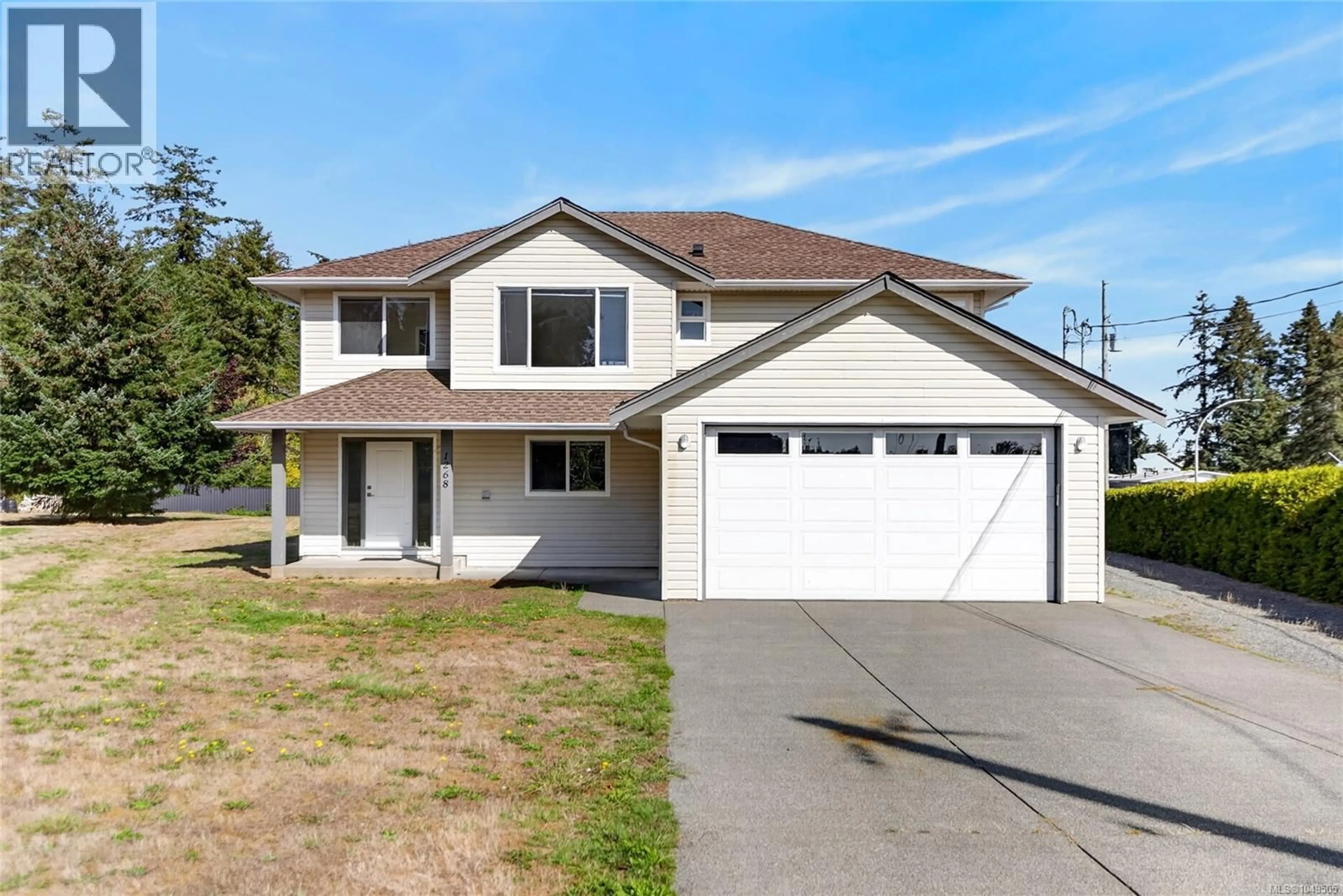 Home with vinyl exterior material, street for 1268 MILLER ROAD, Comox British Columbia V9M4C3