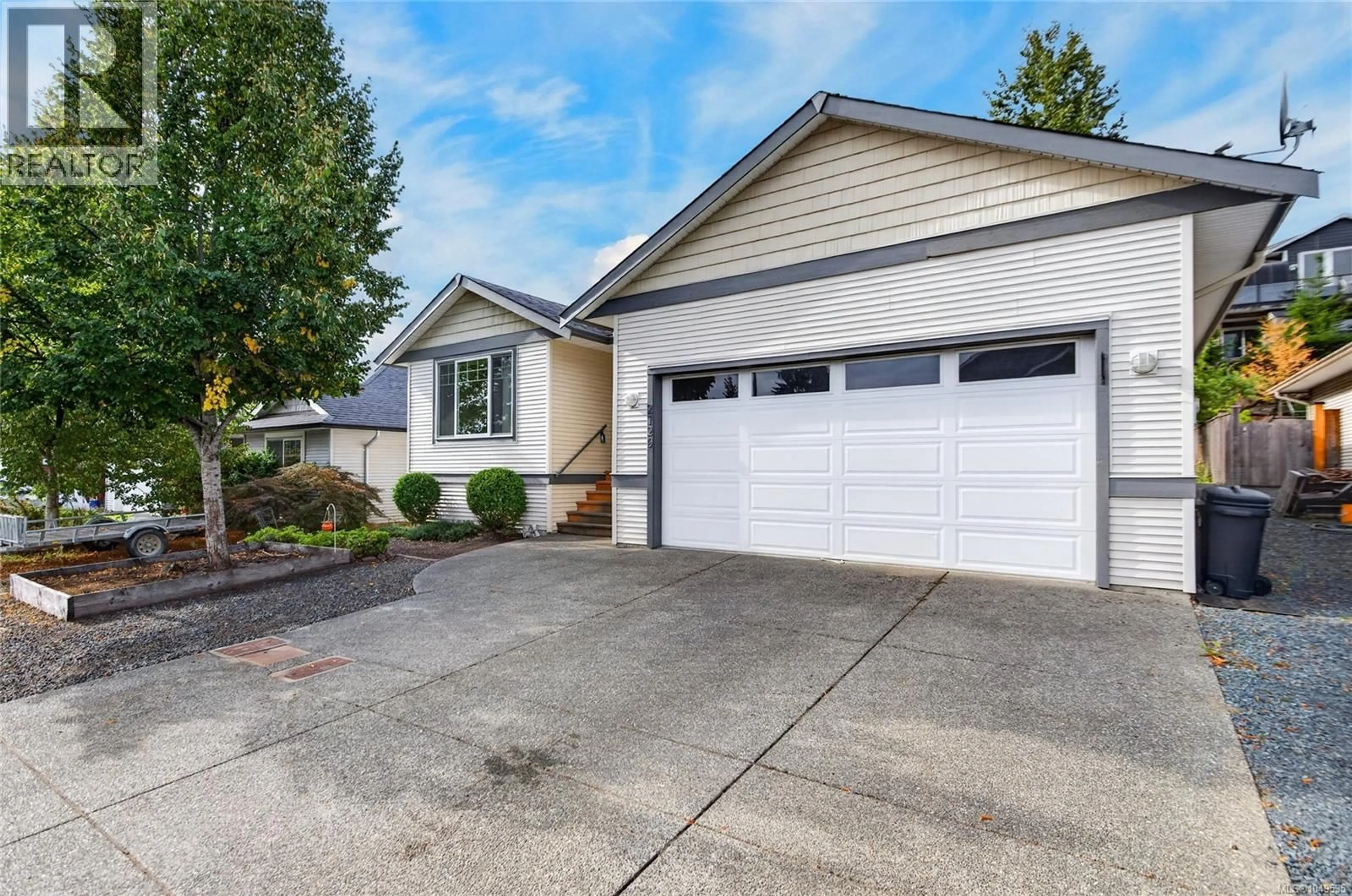 Home with vinyl exterior material, street for 2729 KENDAL AVENUE, Cumberland British Columbia V0R1S0