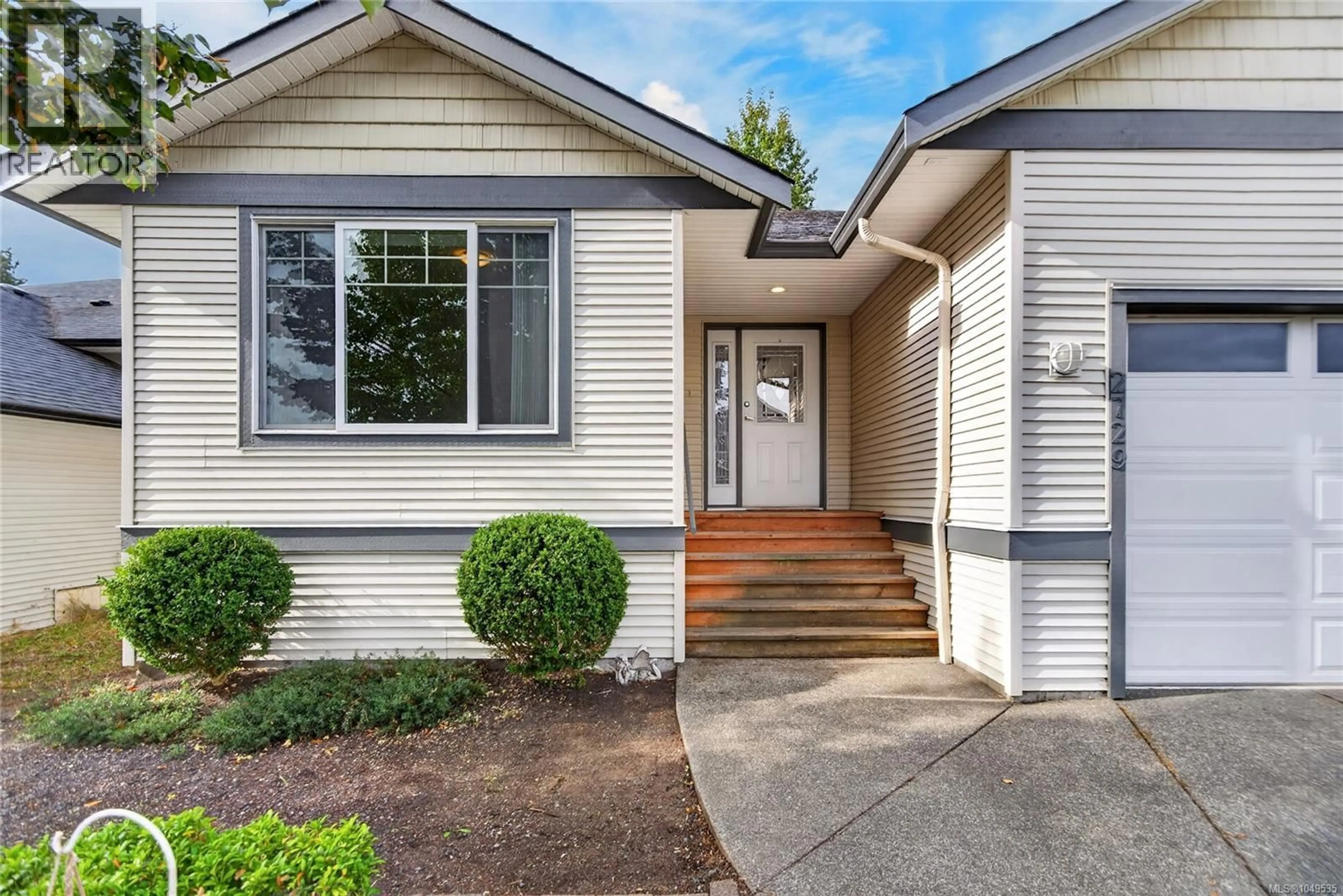 Home with vinyl exterior material, street for 2729 KENDAL AVENUE, Cumberland British Columbia V0R1S0