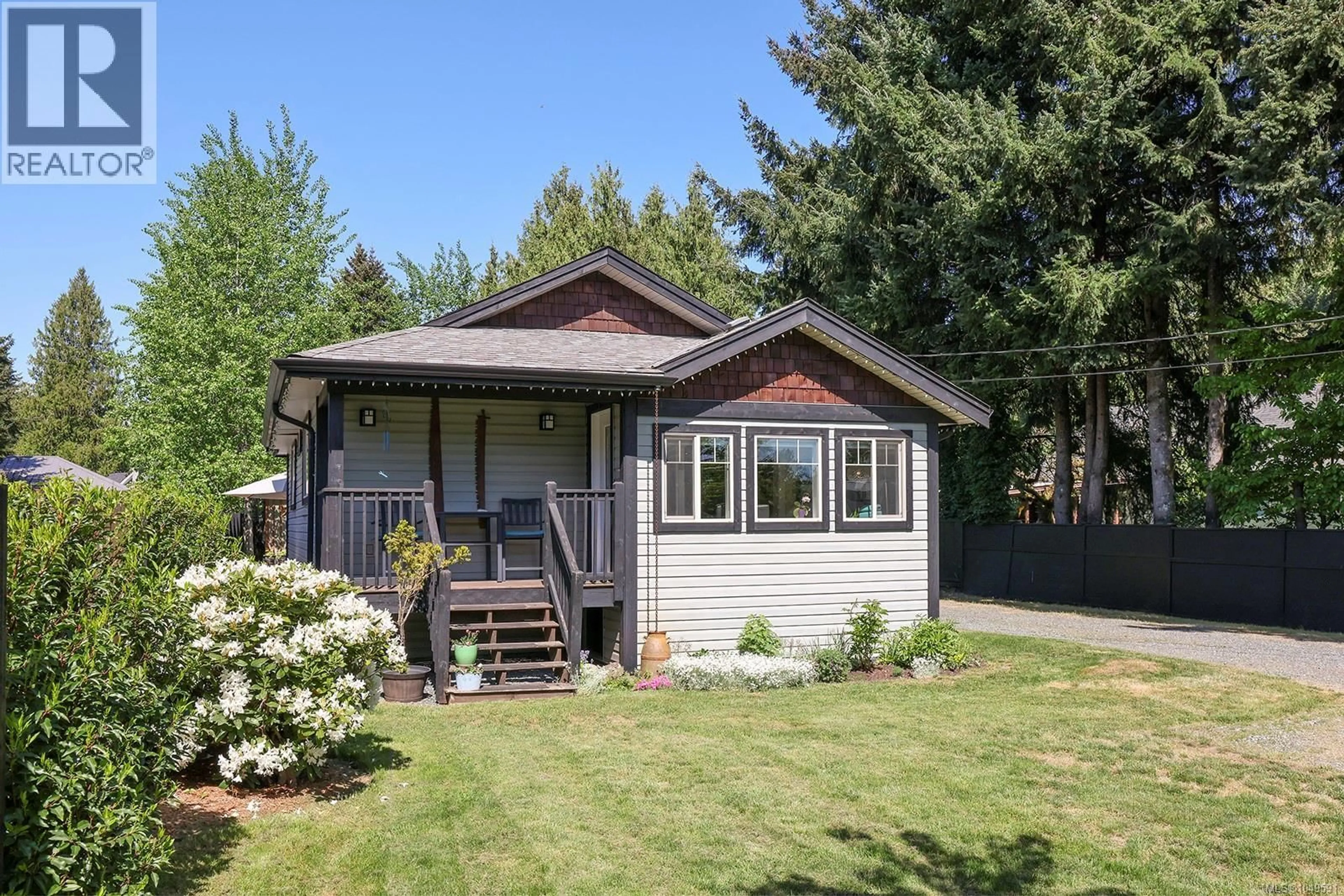 Home with vinyl exterior material, street for 4680 CUMBERLAND ROAD, Cumberland British Columbia V0R1S0