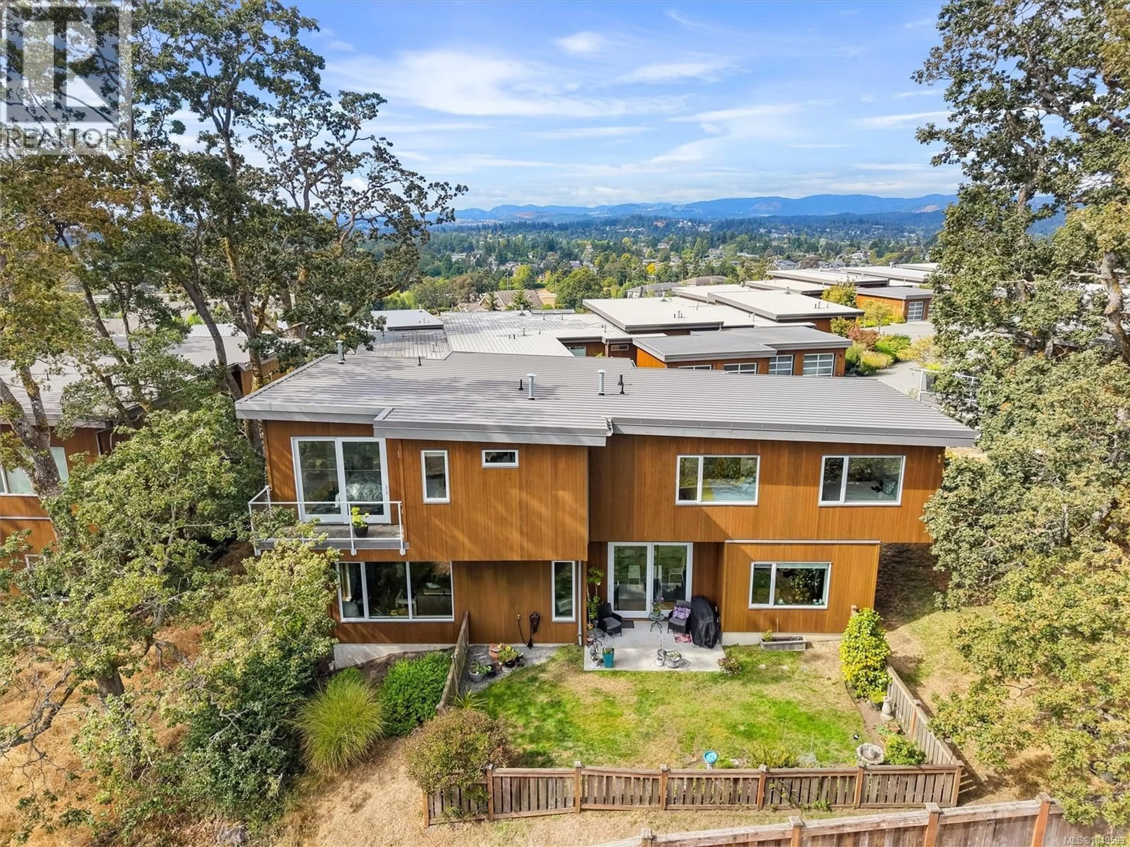 A pic from outside/outdoor area/front of a property/back of a property/a pic from drone, mountain view for 810 RAINBOW RIDGE LANE, Saanich British Columbia V8X0A6