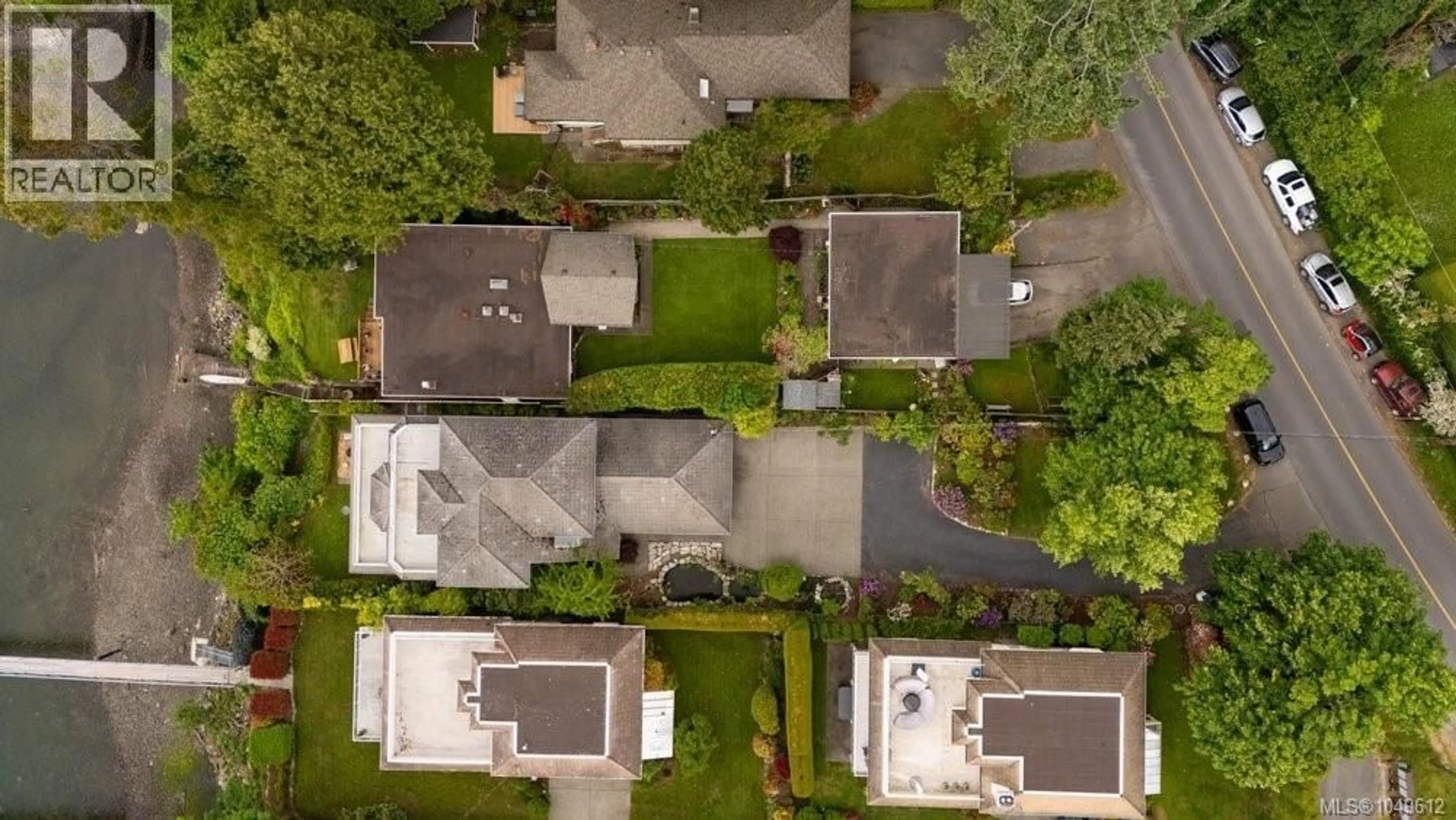 A pic from outside/outdoor area/front of a property/back of a property/a pic from drone, street for 7014 BRENTWOOD DRIVE, Central Saanich British Columbia V8M1B4
