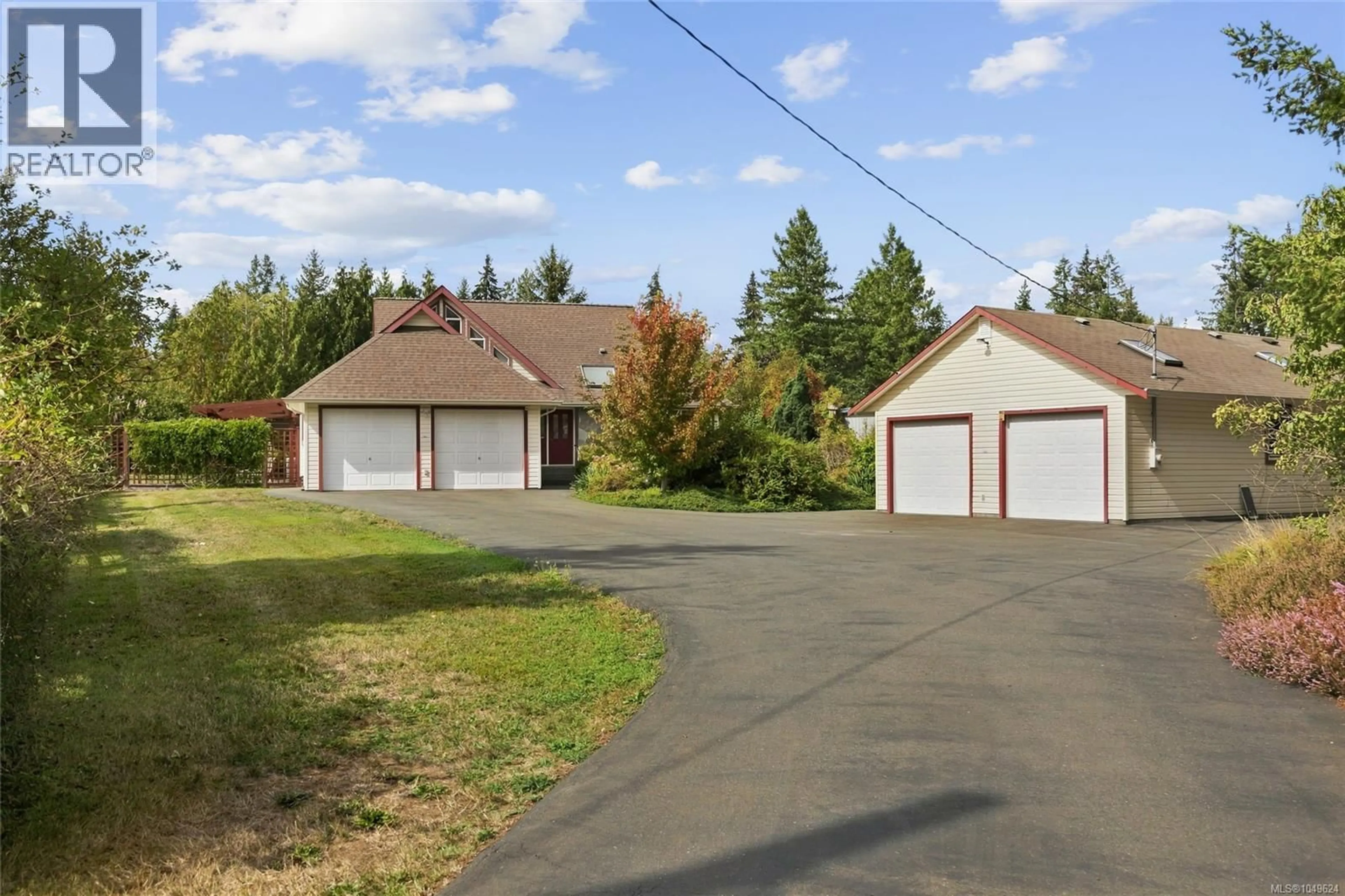 A pic from outside/outdoor area/front of a property/back of a property/a pic from drone, street for 2877 LAKE TRAIL ROAD, Courtenay British Columbia V9N9K8
