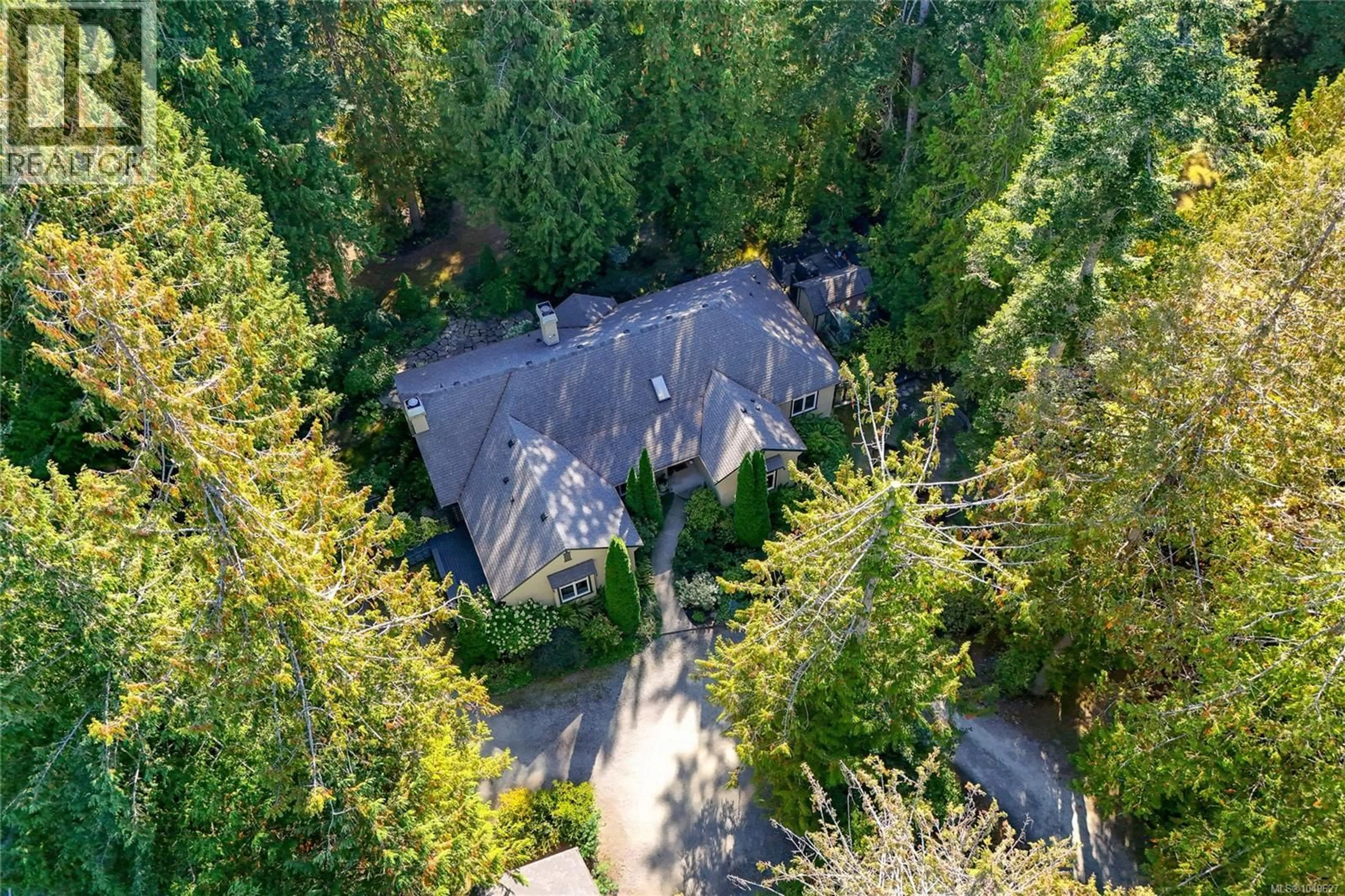 A pic from outside/outdoor area/front of a property/back of a property/a pic from drone, forest/trees view for 671 DALKEITH AVENUE, North Saanich British Columbia V8L5G7