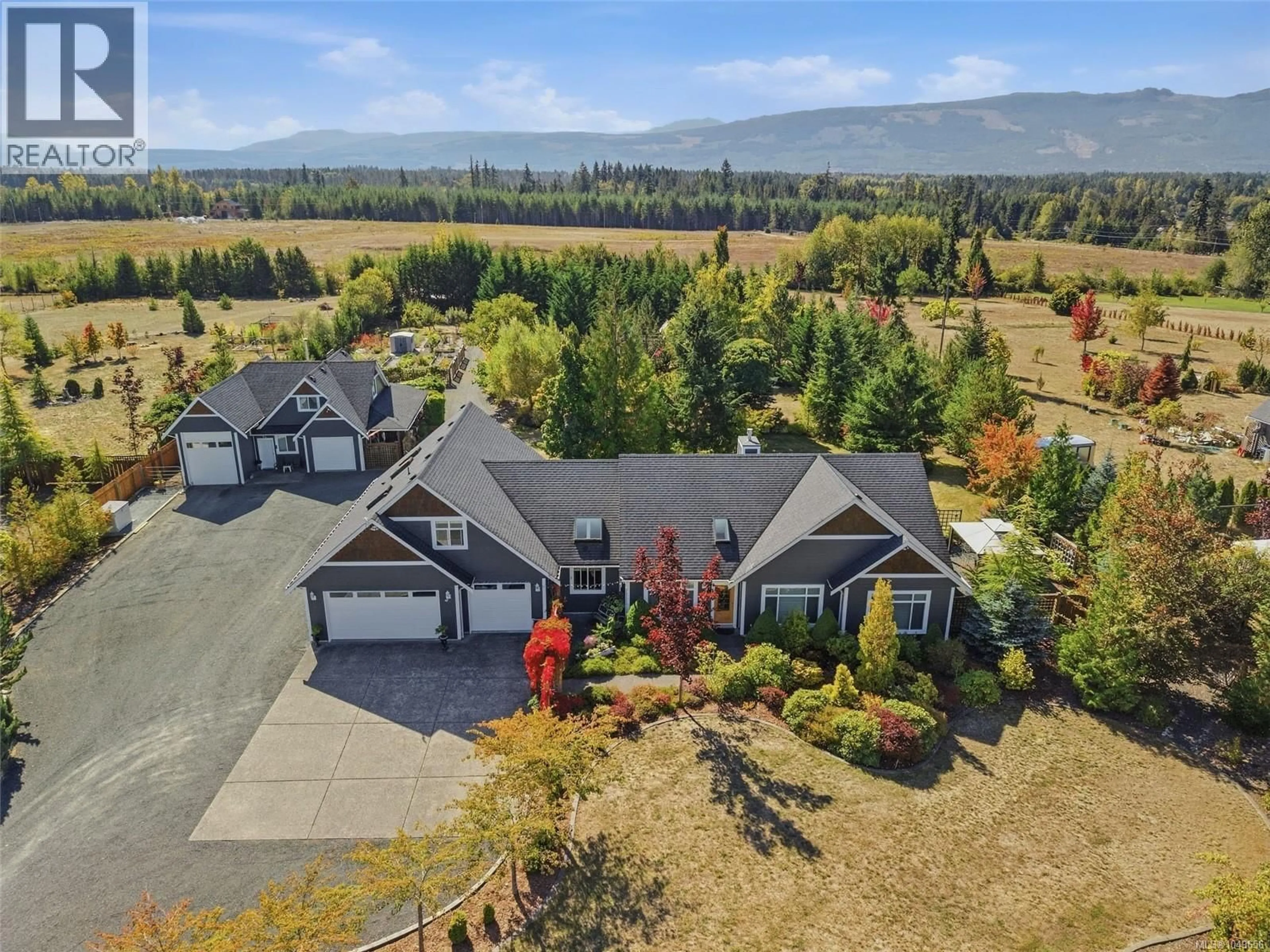 A pic from outside/outdoor area/front of a property/back of a property/a pic from drone, mountain view for 2040 SUN KING ROAD, Coombs British Columbia V0R1M0
