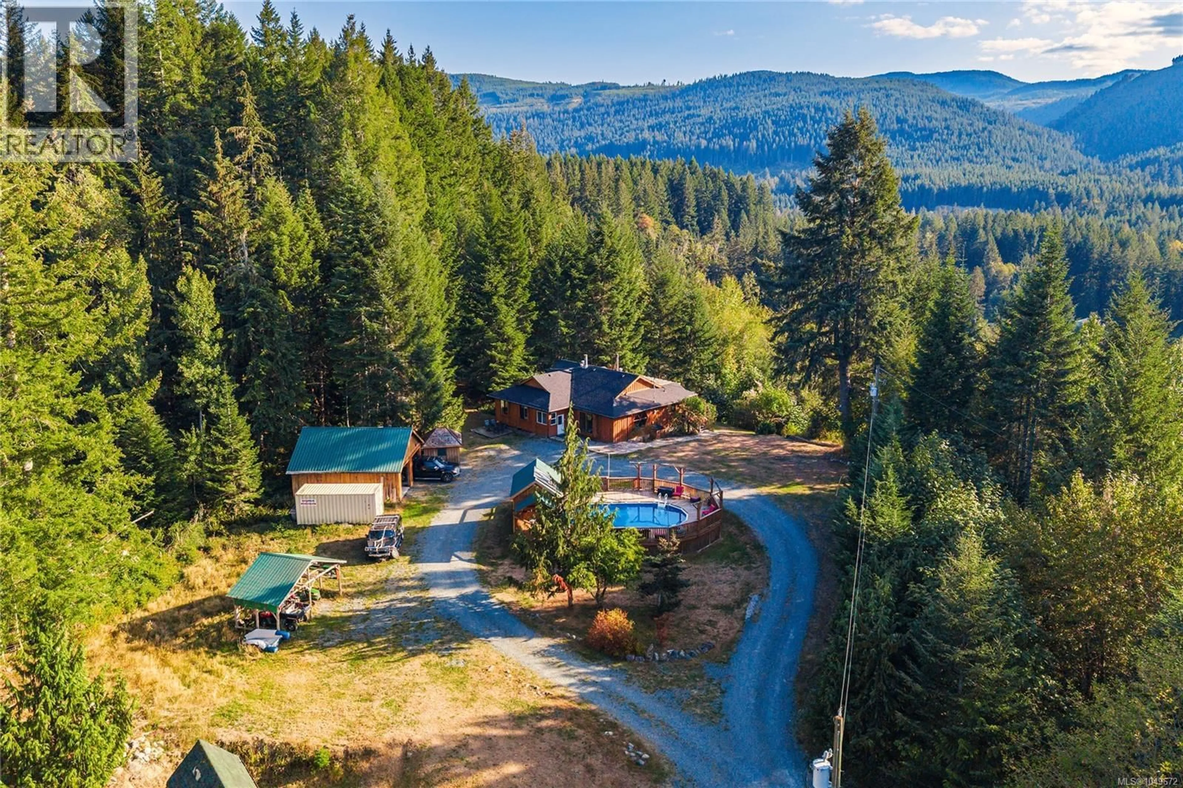A pic from outside/outdoor area/front of a property/back of a property/a pic from drone, forest/trees view for 5982 MAYO ROAD, Lake Cowichan British Columbia V0R2G0