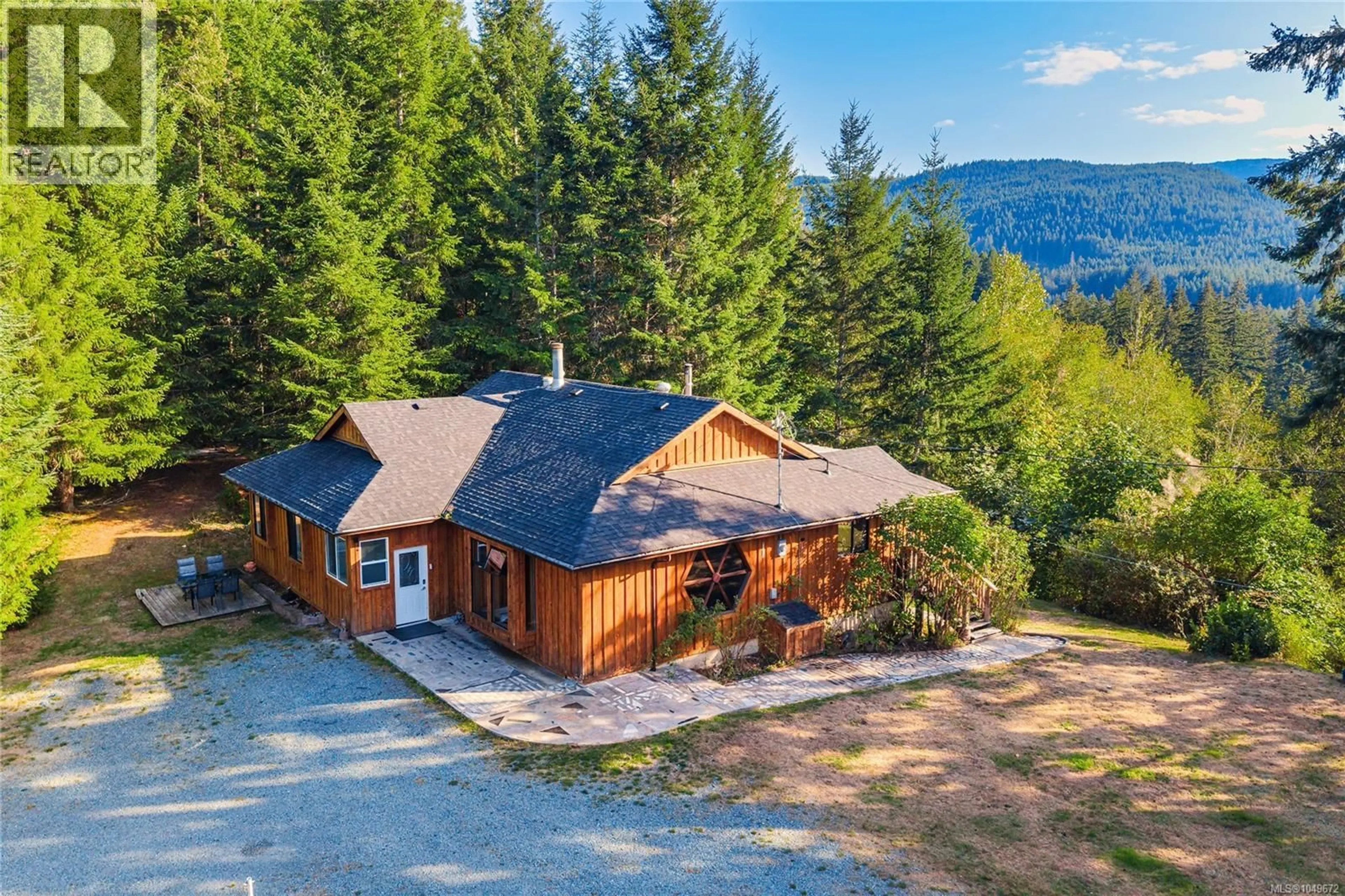 A pic from outside/outdoor area/front of a property/back of a property/a pic from drone, mountain view for 5982 MAYO ROAD, Lake Cowichan British Columbia V0R2G0