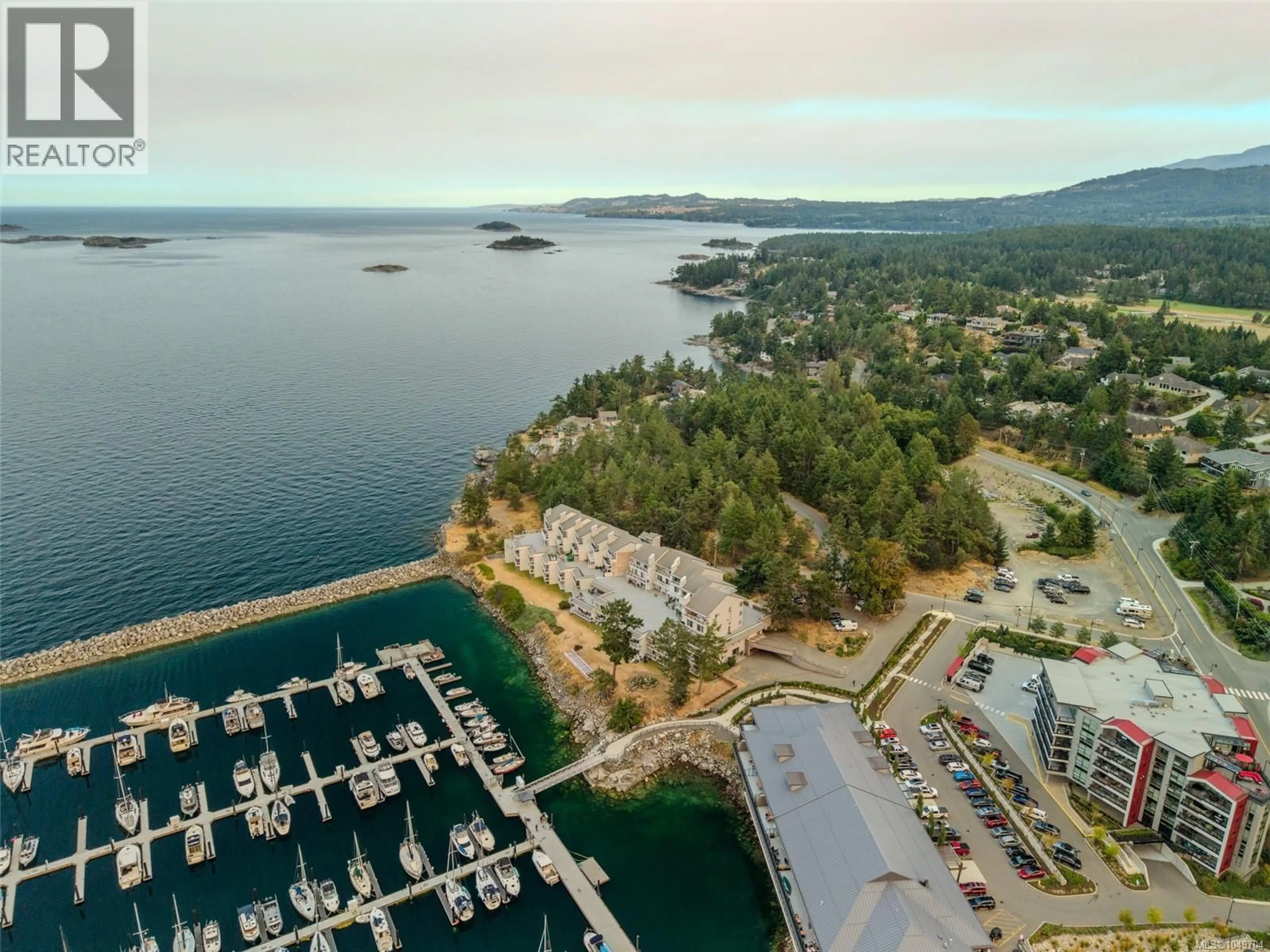 A pic from outside/outdoor area/front of a property/back of a property/a pic from drone, water/lake/river/ocean view for 403 - 3555 OUTRIGGER ROAD, Nanoose Bay British Columbia V9P9K1