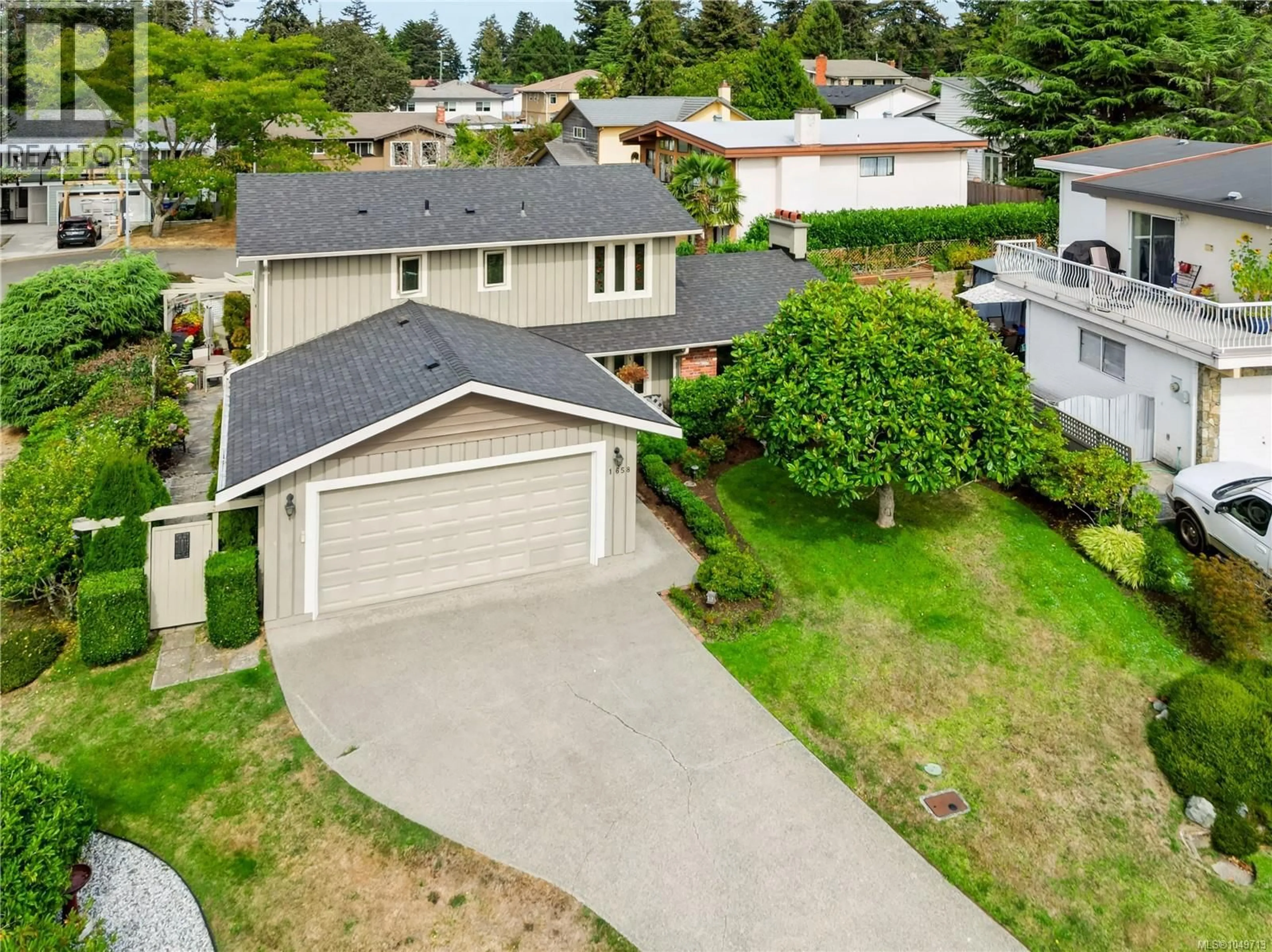 A pic from outside/outdoor area/front of a property/back of a property/a pic from drone, street for 1658 BROUSSON DRIVE, Saanich British Columbia V8N5S2