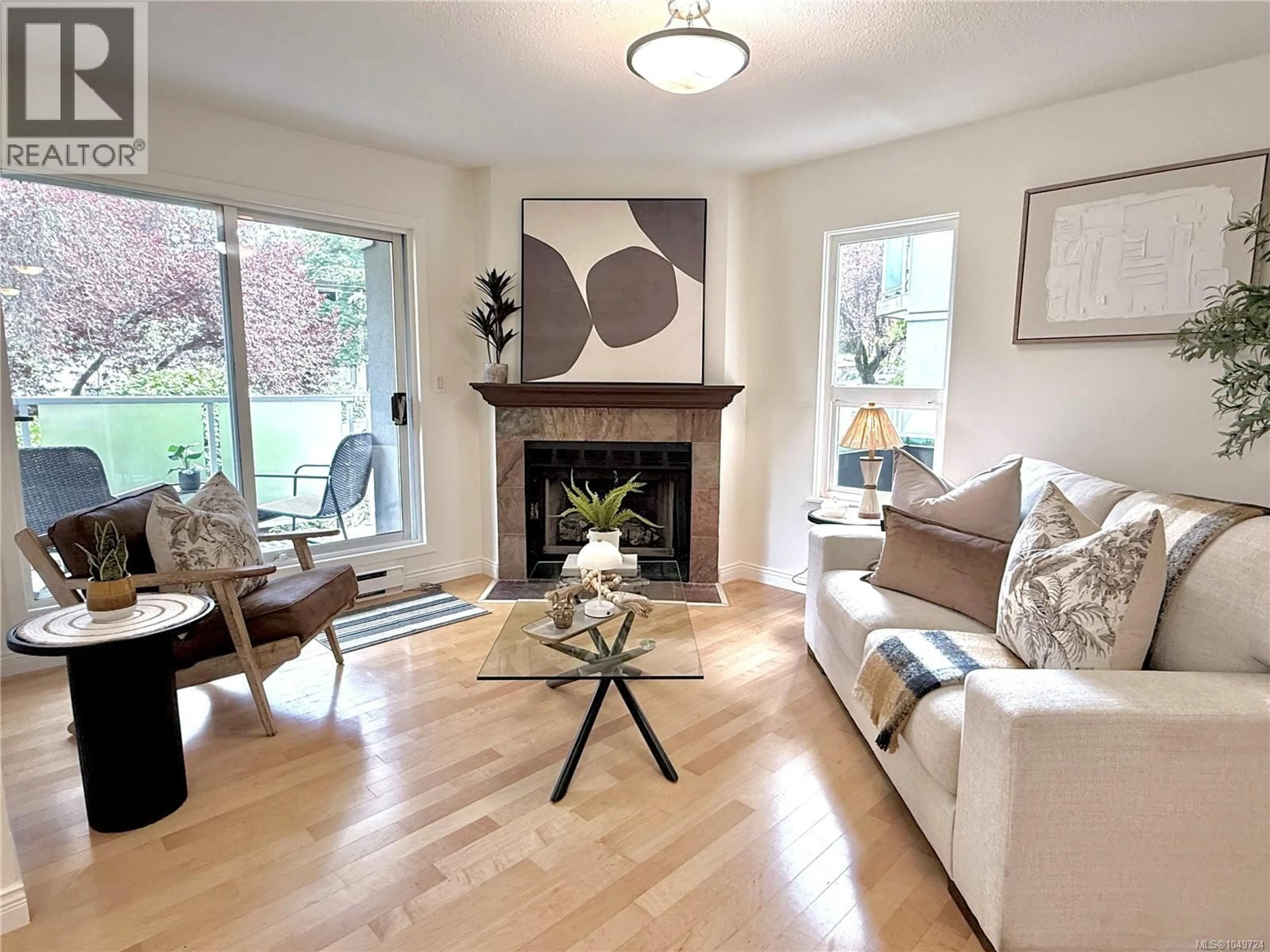Living room with furniture, wood/laminate floor for 201 - 2520 WARK STREET, Victoria British Columbia V8T5G6
