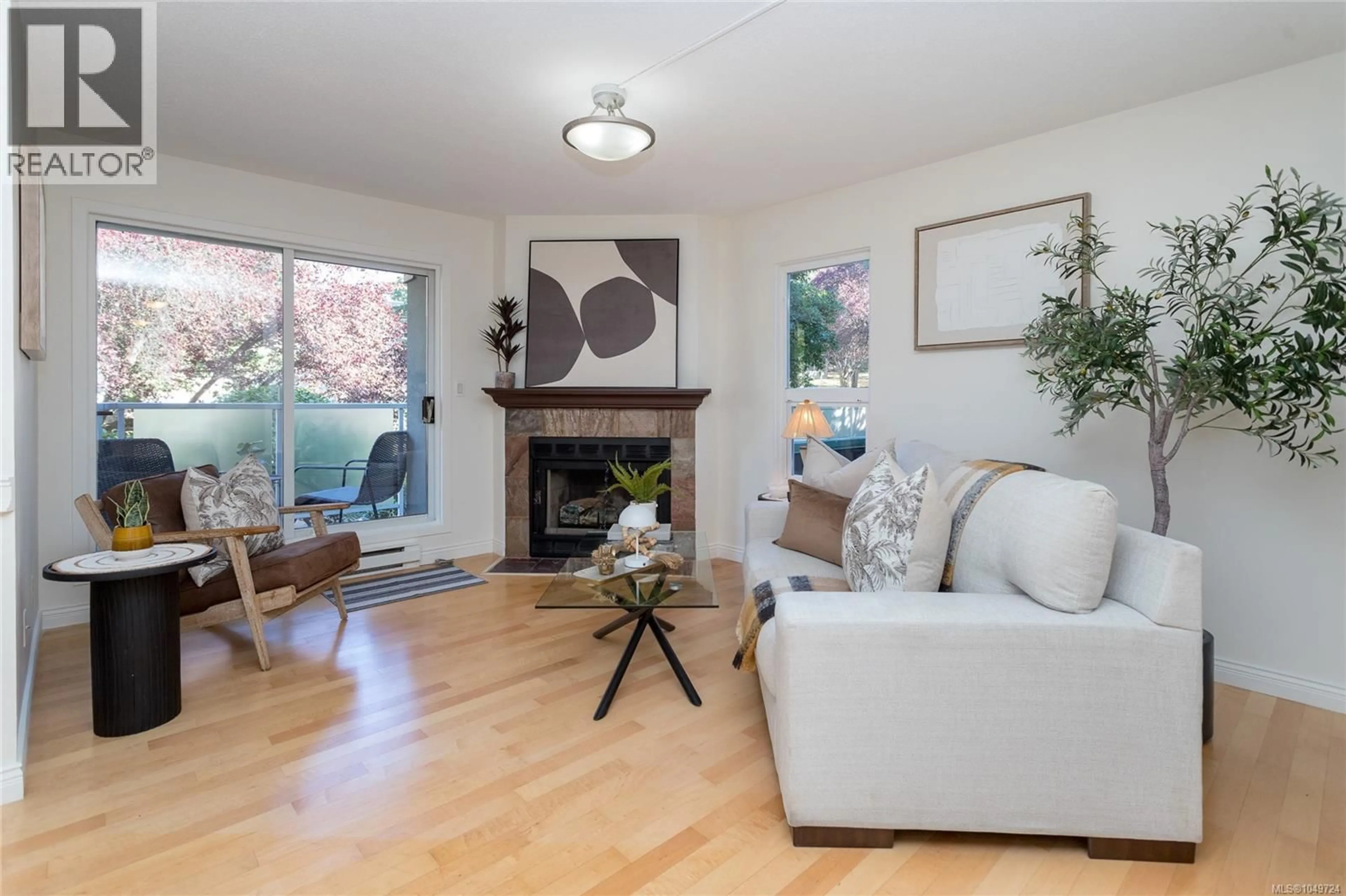 Living room with furniture, wood/laminate floor for 201 - 2520 WARK STREET, Victoria British Columbia V8T5G6