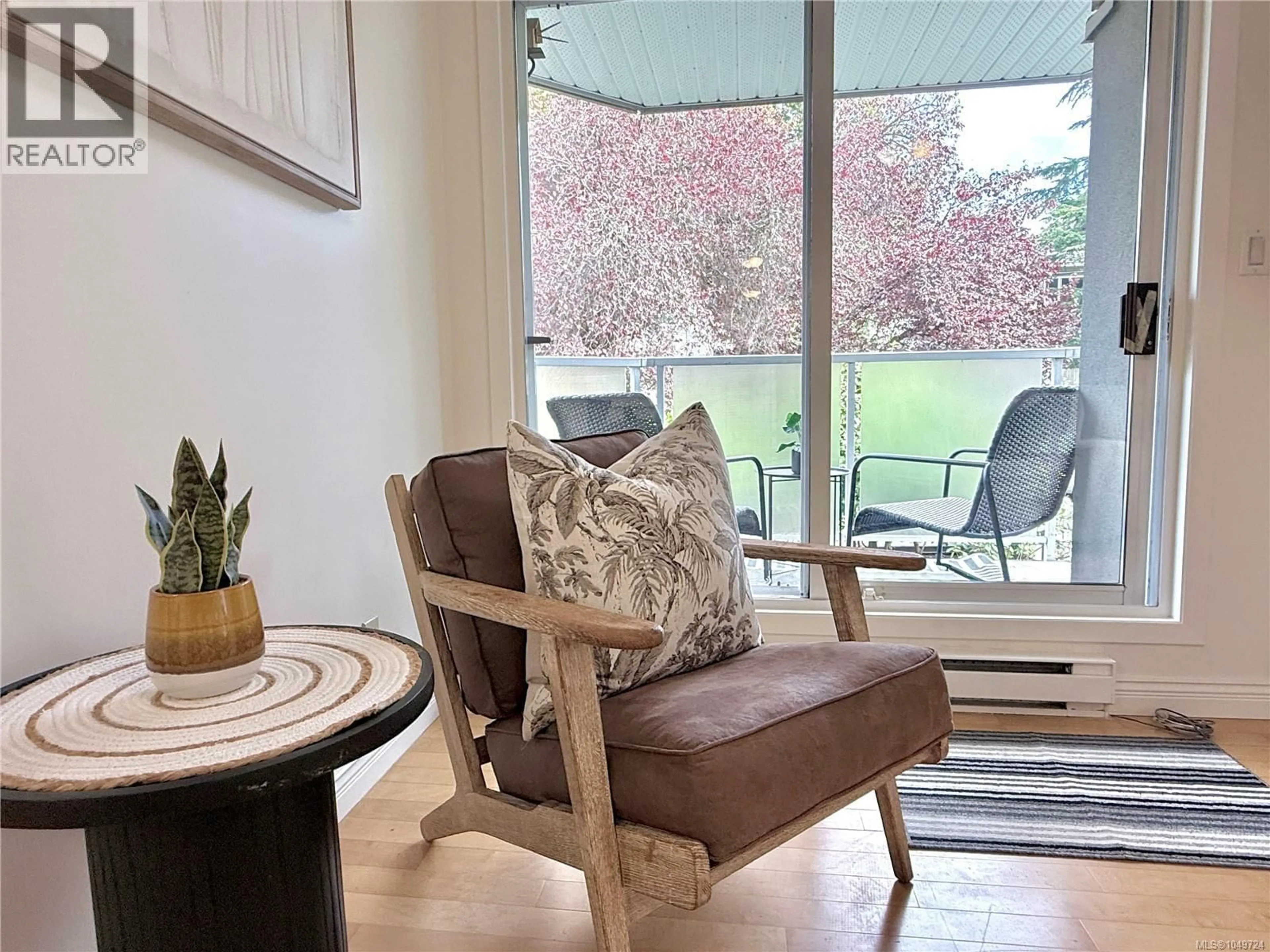 Living room with furniture, wood/laminate floor for 201 - 2520 WARK STREET, Victoria British Columbia V8T5G6
