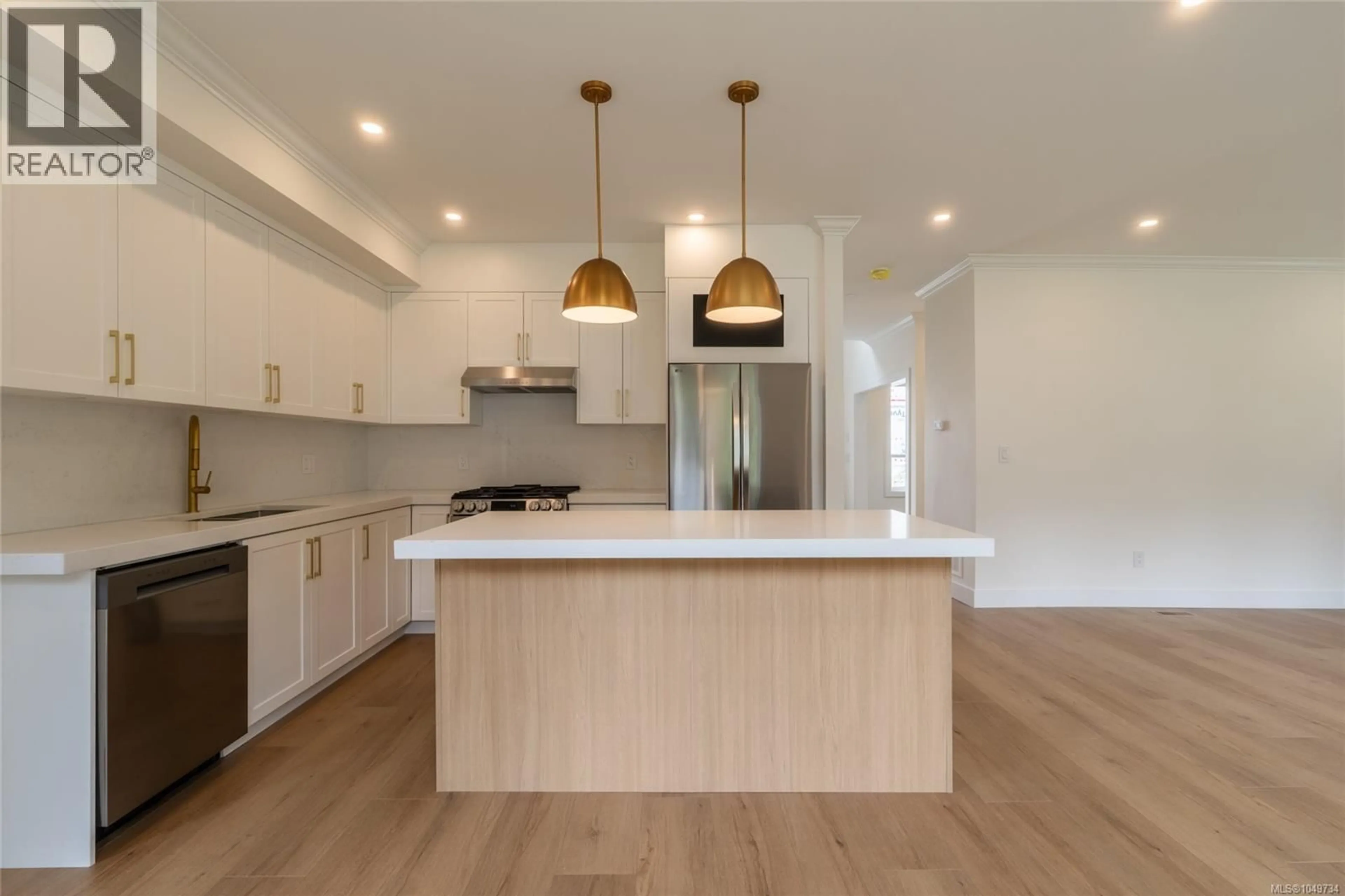 Open concept kitchen, wood/laminate floor for 557 BELFORD PLACE, Langford British Columbia V9B6C1