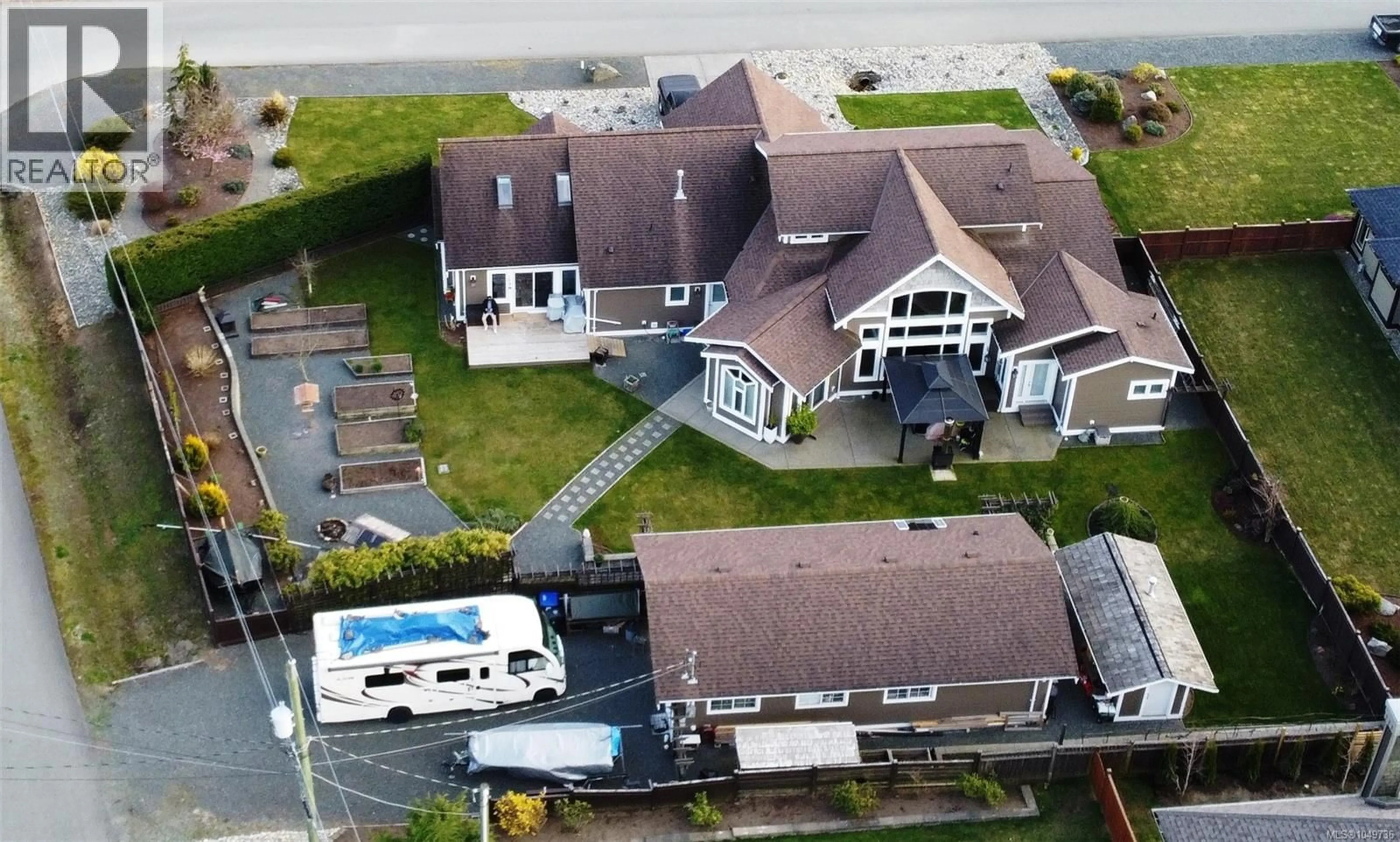 A pic from outside/outdoor area/front of a property/back of a property/a pic from drone, street for 1430 STONE LAKE DRIVE, Nanoose Bay British Columbia V9P9M4