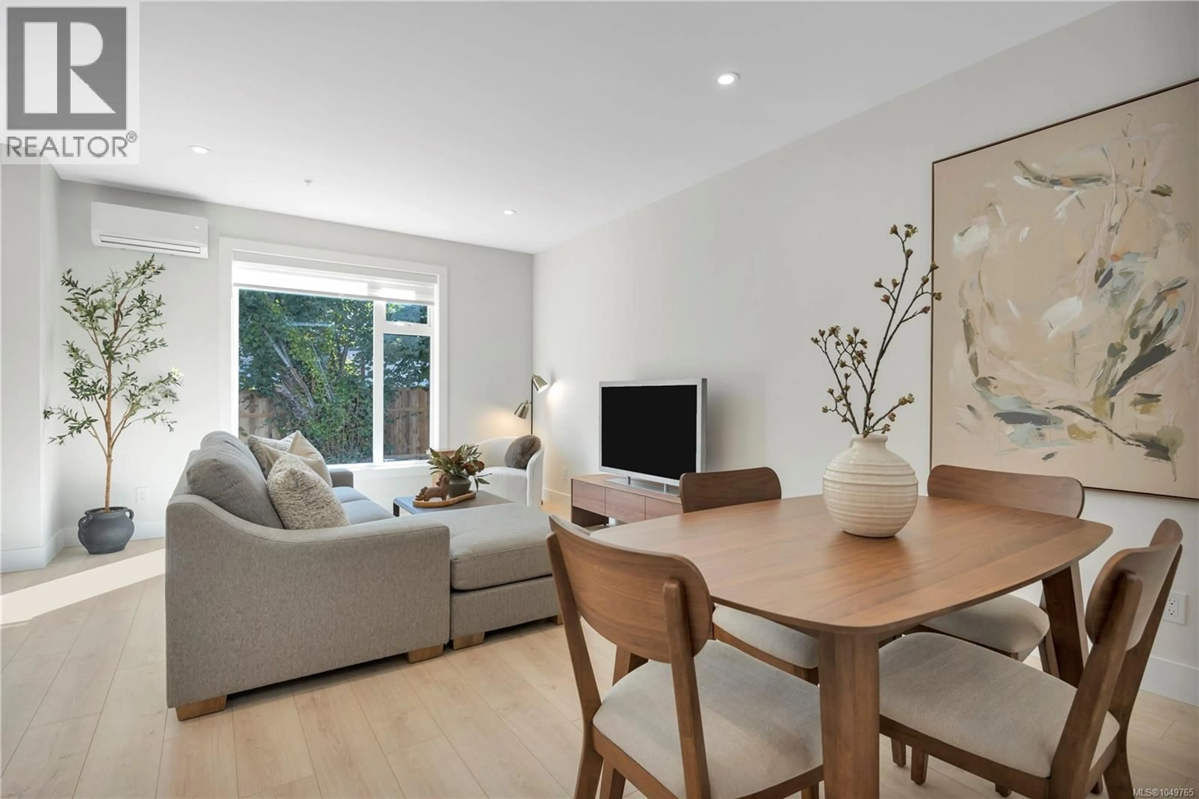 Living room with furniture, wood/laminate floor for 103 - 6004 NELSON ROAD, Nanaimo British Columbia V9T5N7