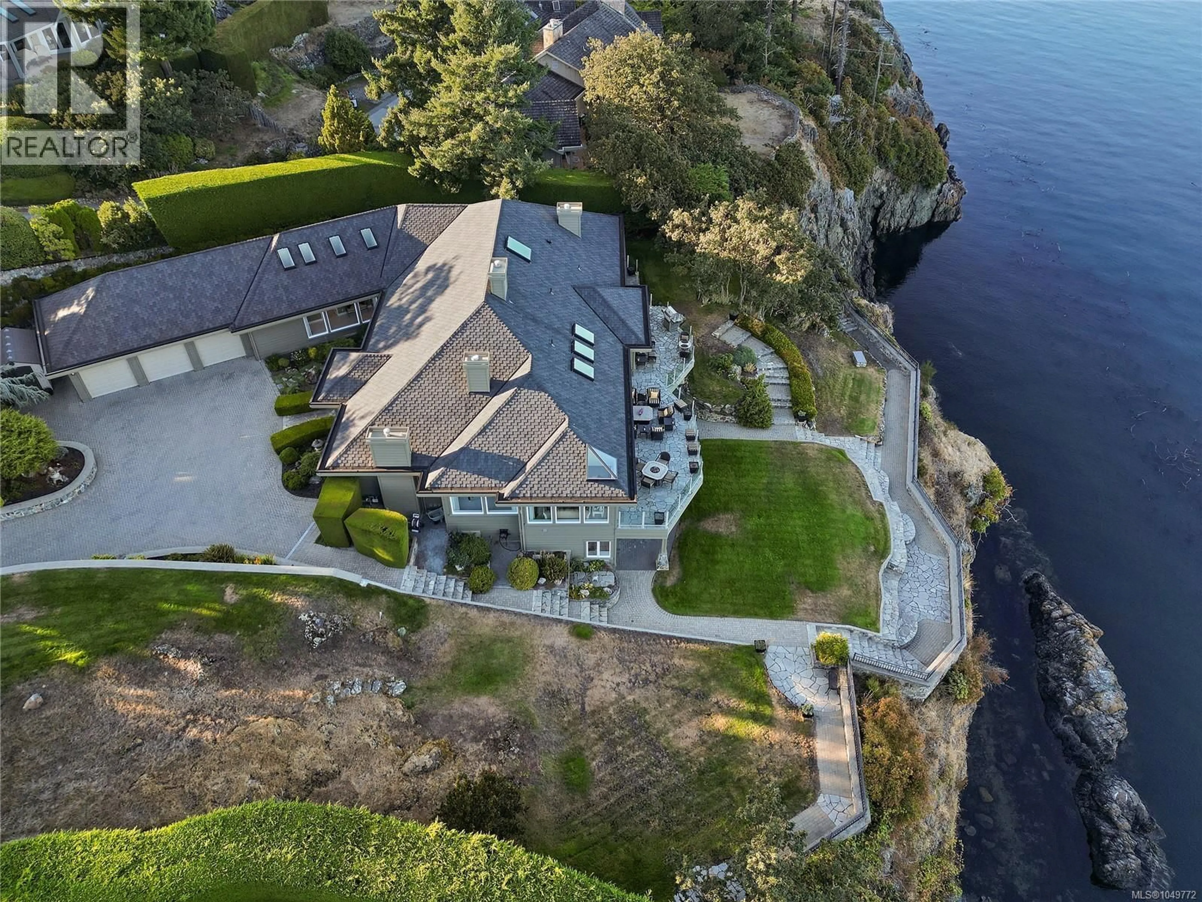 A pic from outside/outdoor area/front of a property/back of a property/a pic from drone, water/lake/river/ocean view for 4532 GORDON POINT DRIVE, Saanich British Columbia V8N6L2