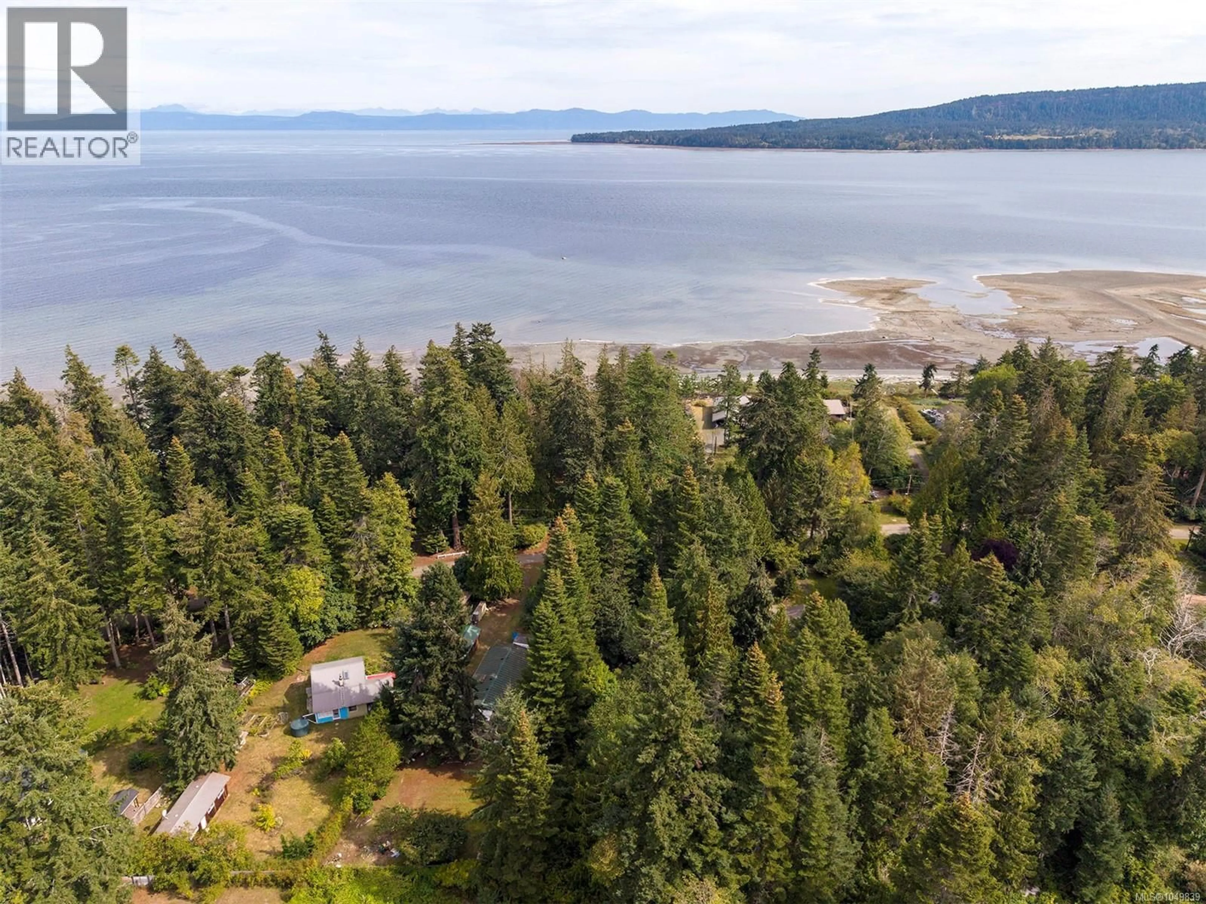 A pic from outside/outdoor area/front of a property/back of a property/a pic from drone, water/lake/river/ocean view for 1701 DALZIEL ROAD, Denman Island British Columbia V0R1T0