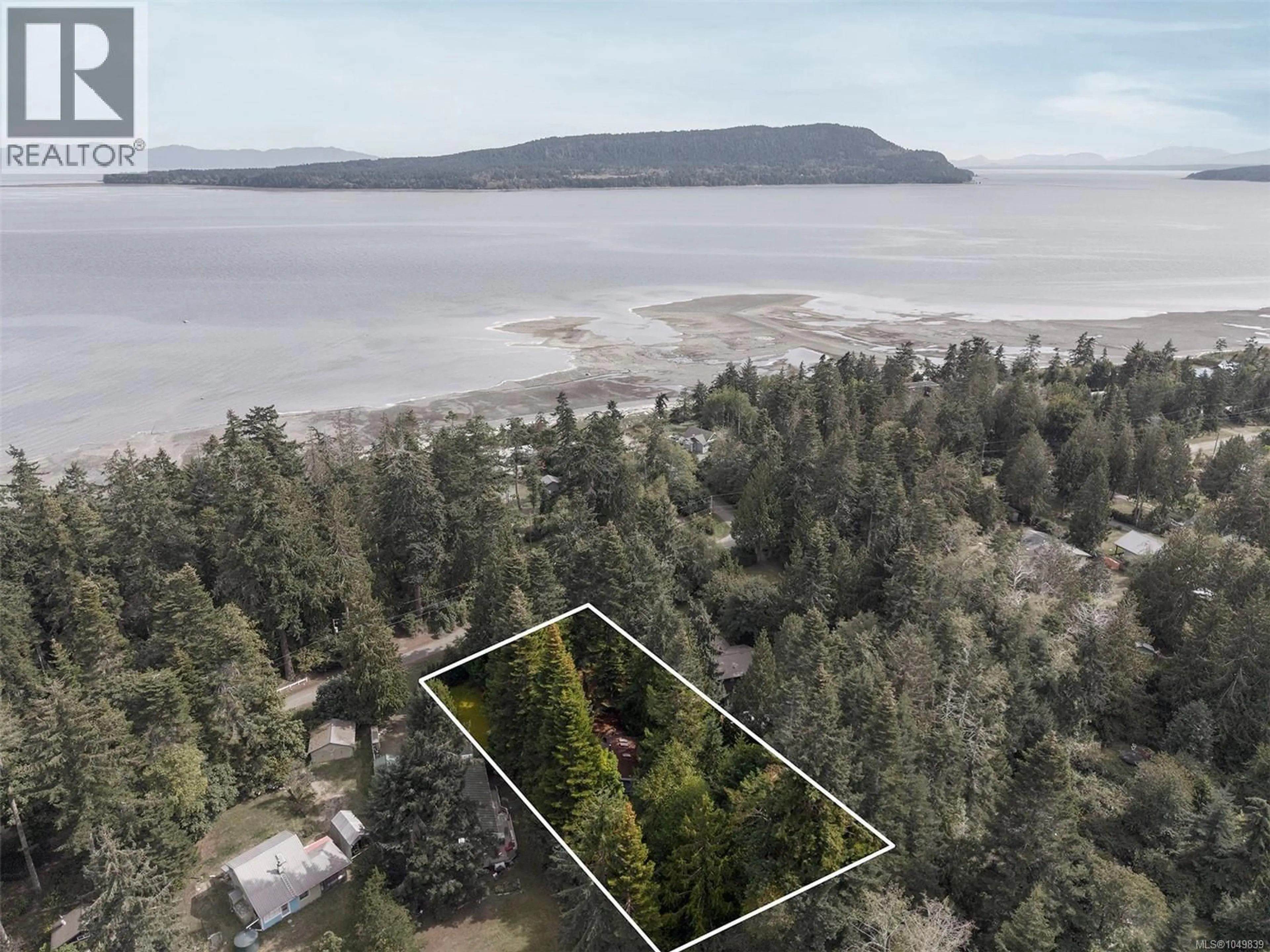 A pic from outside/outdoor area/front of a property/back of a property/a pic from drone, water/lake/river/ocean view for 1701 DALZIEL ROAD, Denman Island British Columbia V0R1T0