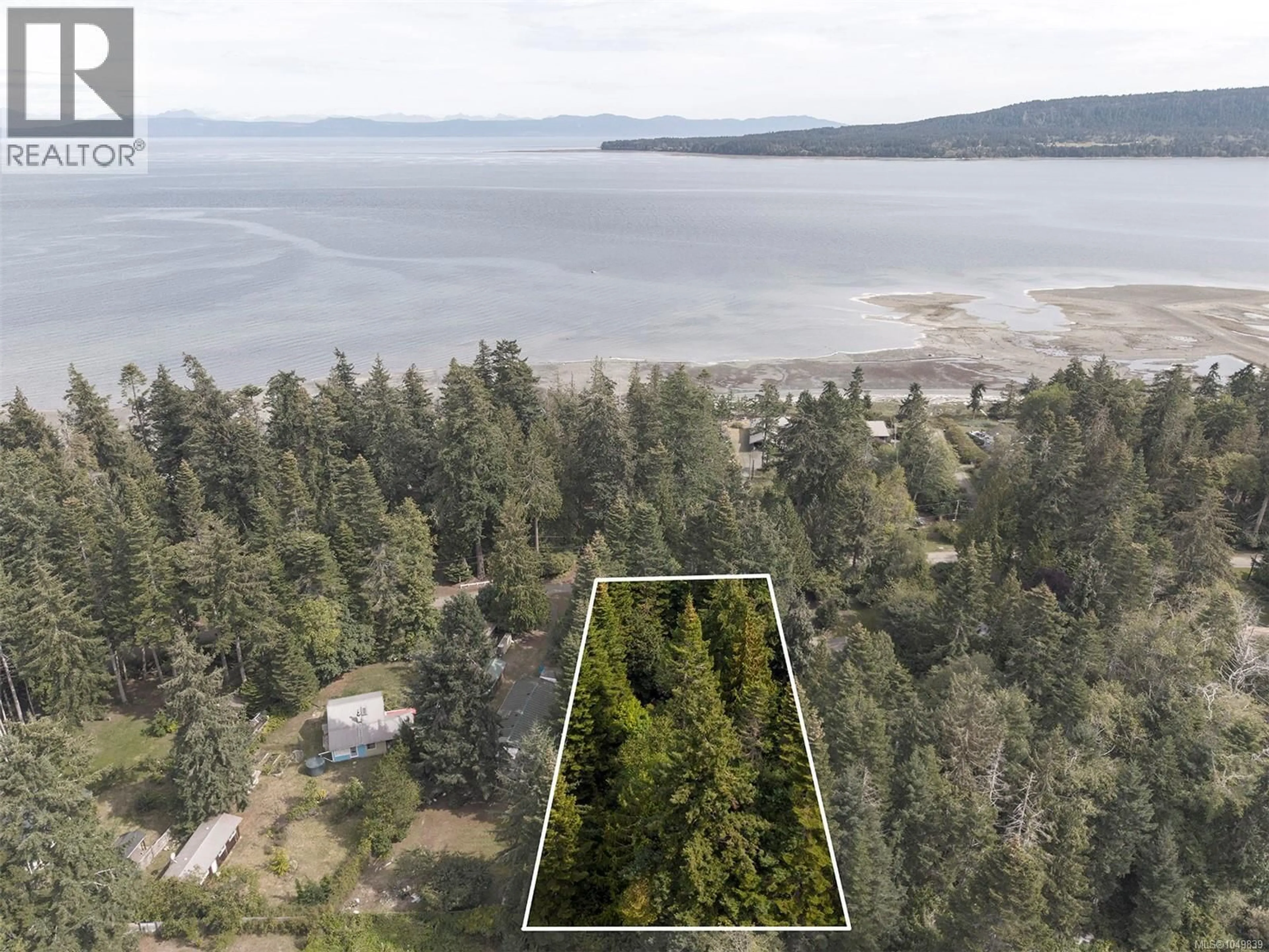 A pic from outside/outdoor area/front of a property/back of a property/a pic from drone, water/lake/river/ocean view for 1701 DALZIEL ROAD, Denman Island British Columbia V0R1T0