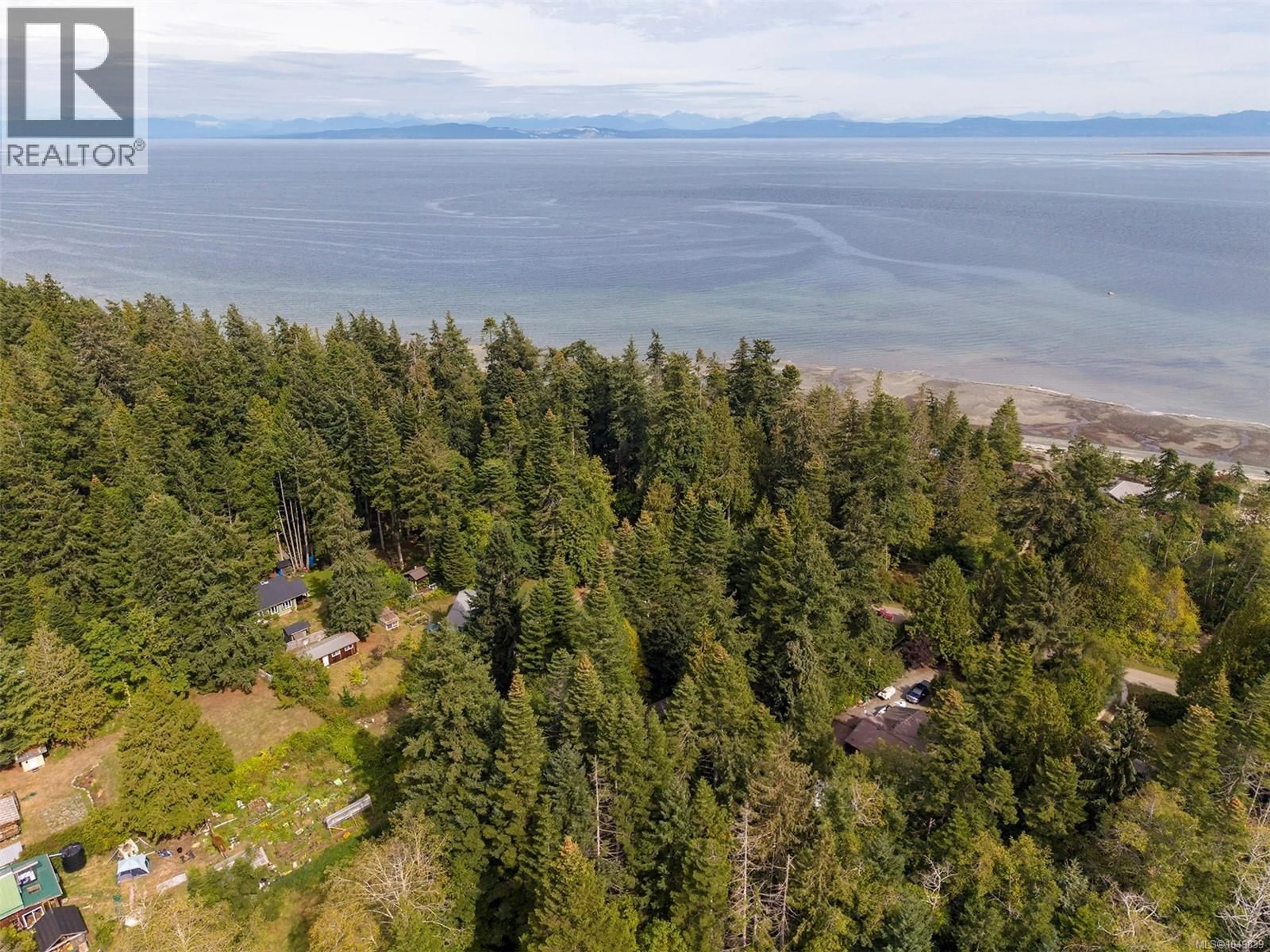 A pic from outside/outdoor area/front of a property/back of a property/a pic from drone, water/lake/river/ocean view for 1701 DALZIEL ROAD, Denman Island British Columbia V0R1T0