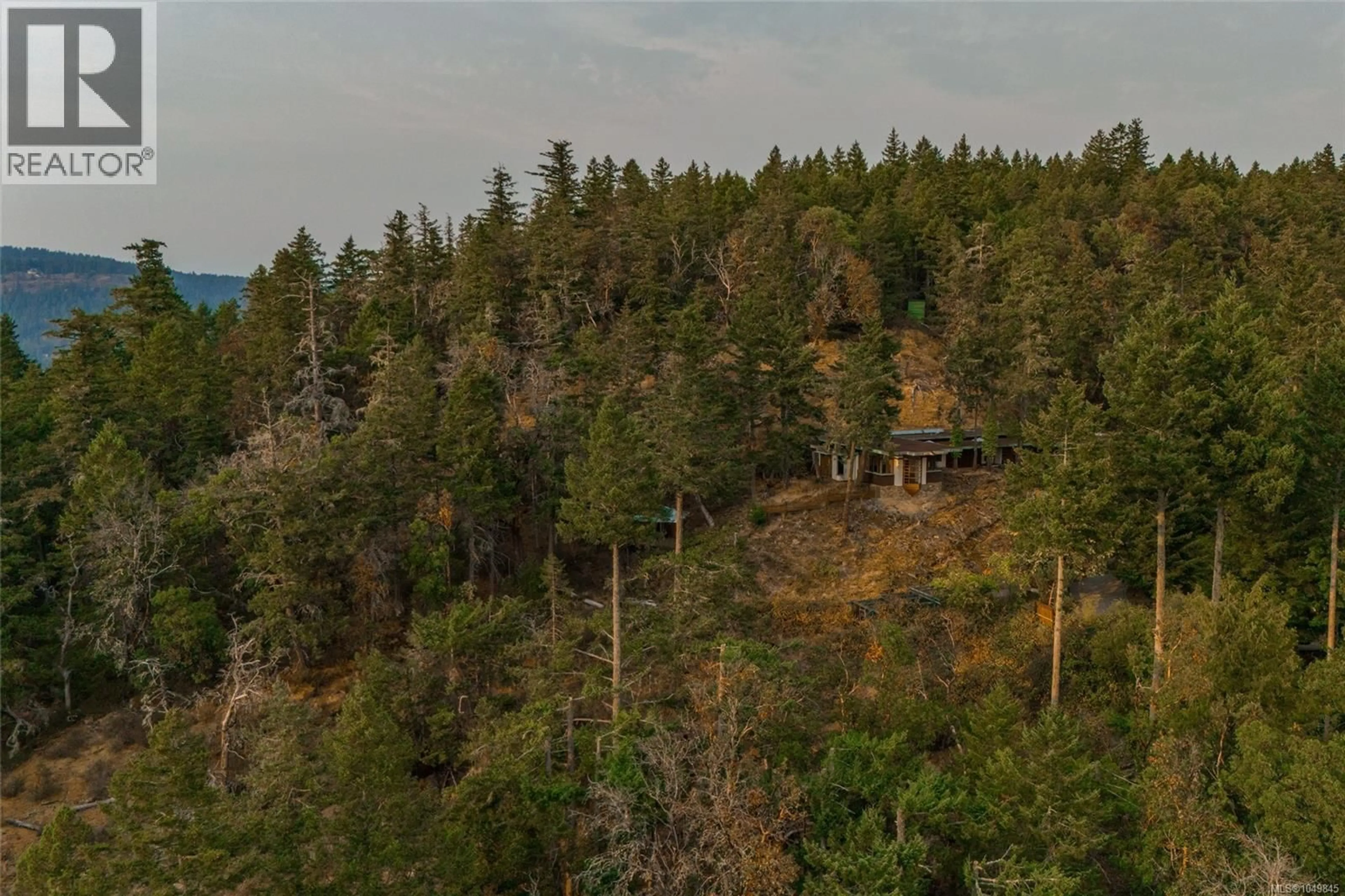 A pic from outside/outdoor area/front of a property/back of a property/a pic from drone, forest/trees view for 3326 PORT WASHINGTON ROAD, Pender Island British Columbia V0N2M1
