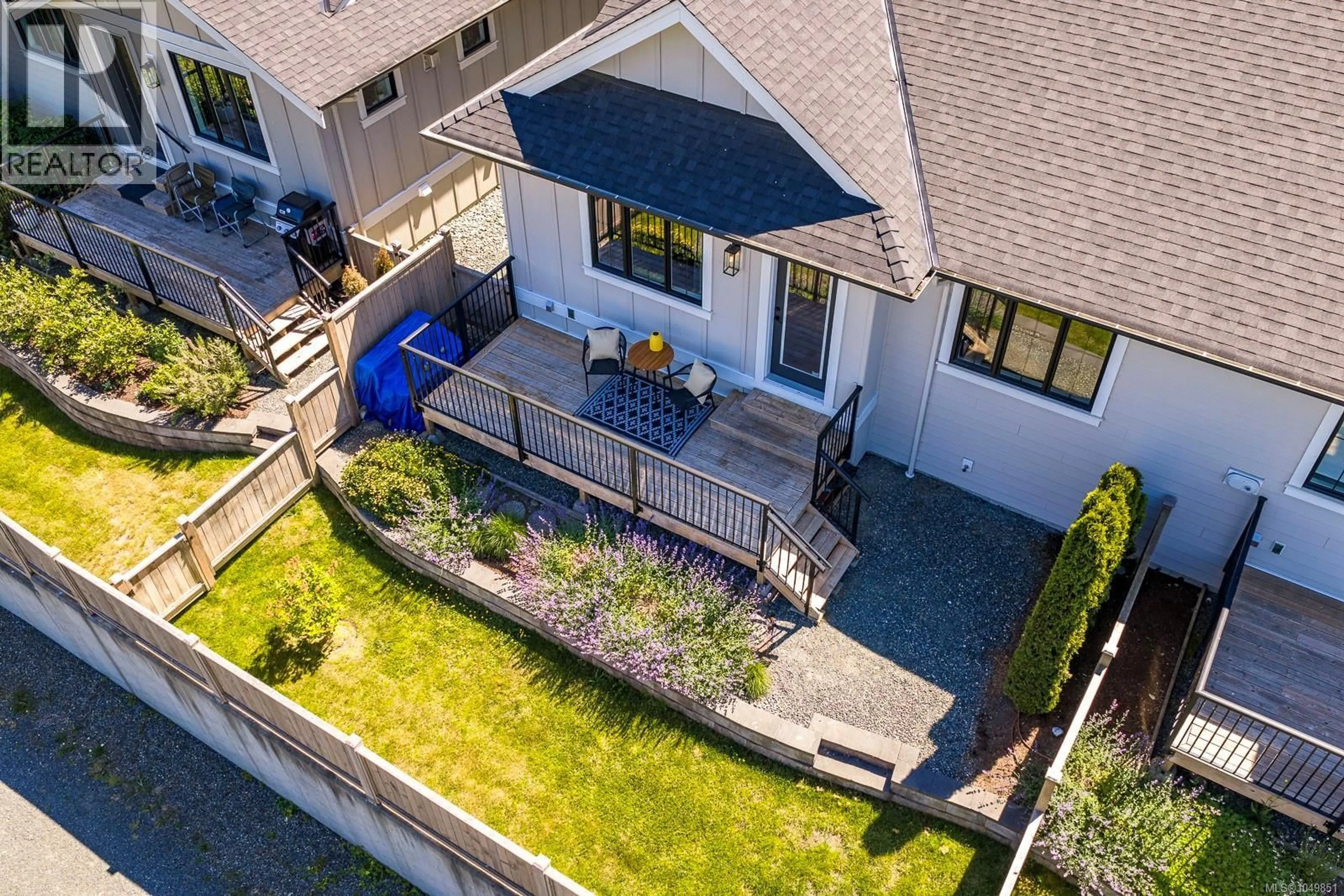 A pic from outside/outdoor area/front of a property/back of a property/a pic from drone, street for 107 - 4098 BUCKSTONE ROAD, Courtenay British Columbia V9N0H2