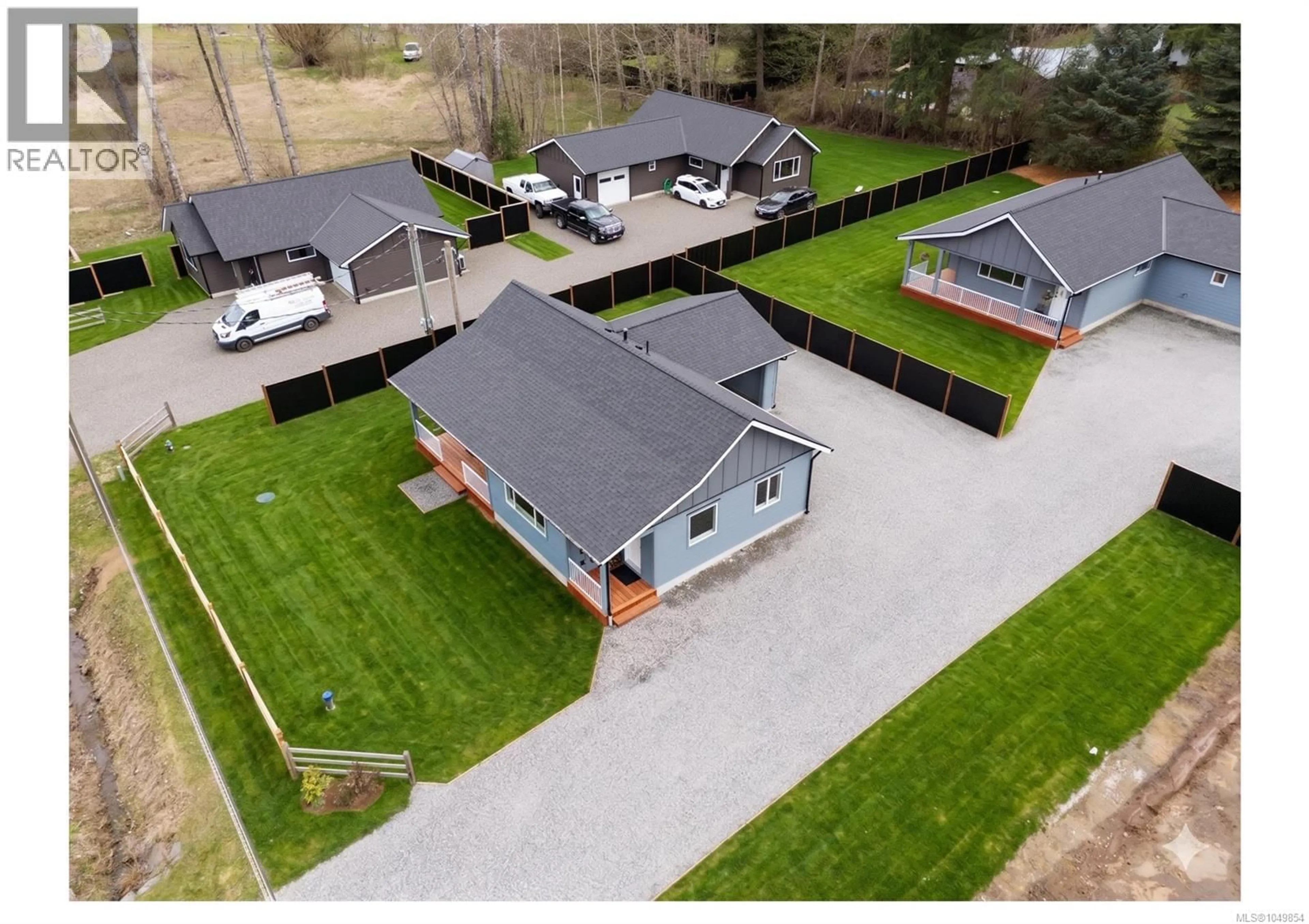 A pic from outside/outdoor area/front of a property/back of a property/a pic from drone, street for 1963 WILFRED ROAD, Black Creek British Columbia V9J1J8