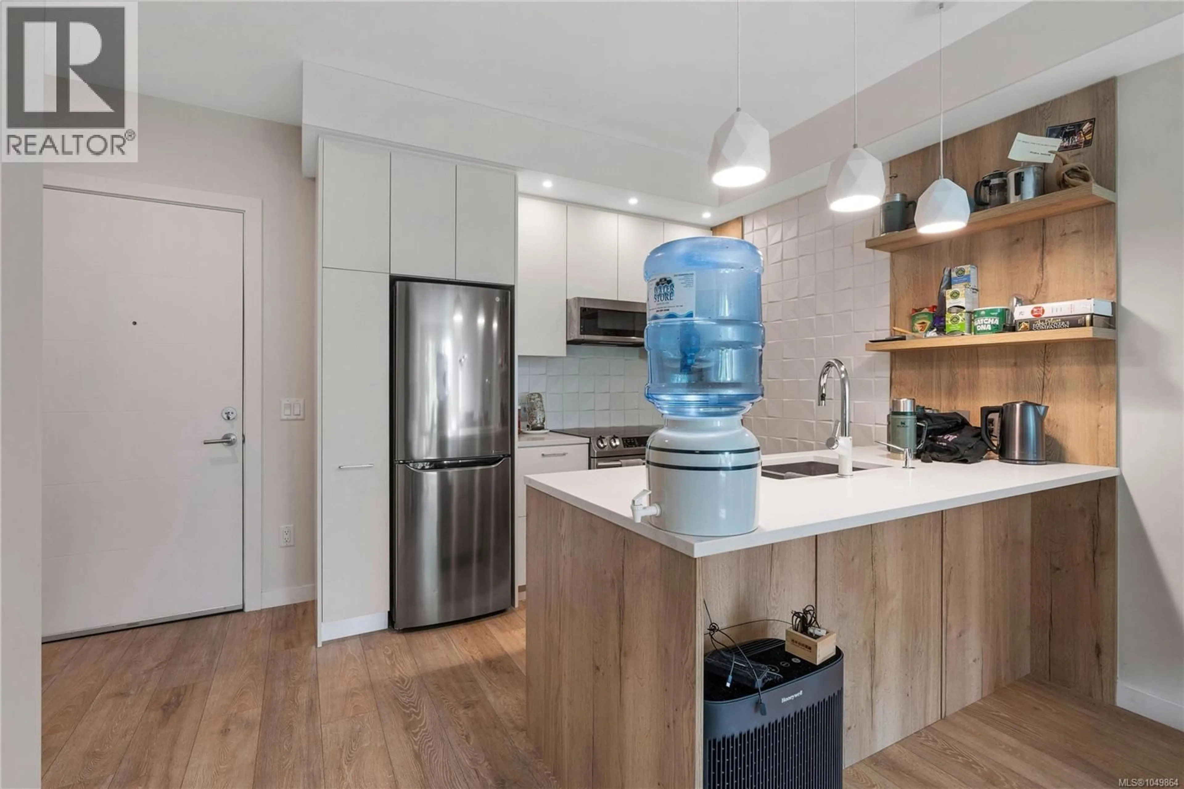 Open concept kitchen, wood/laminate floor for 204 - 1588 NORTH DAIRY ROAD, Saanich British Columbia V8T0E1
