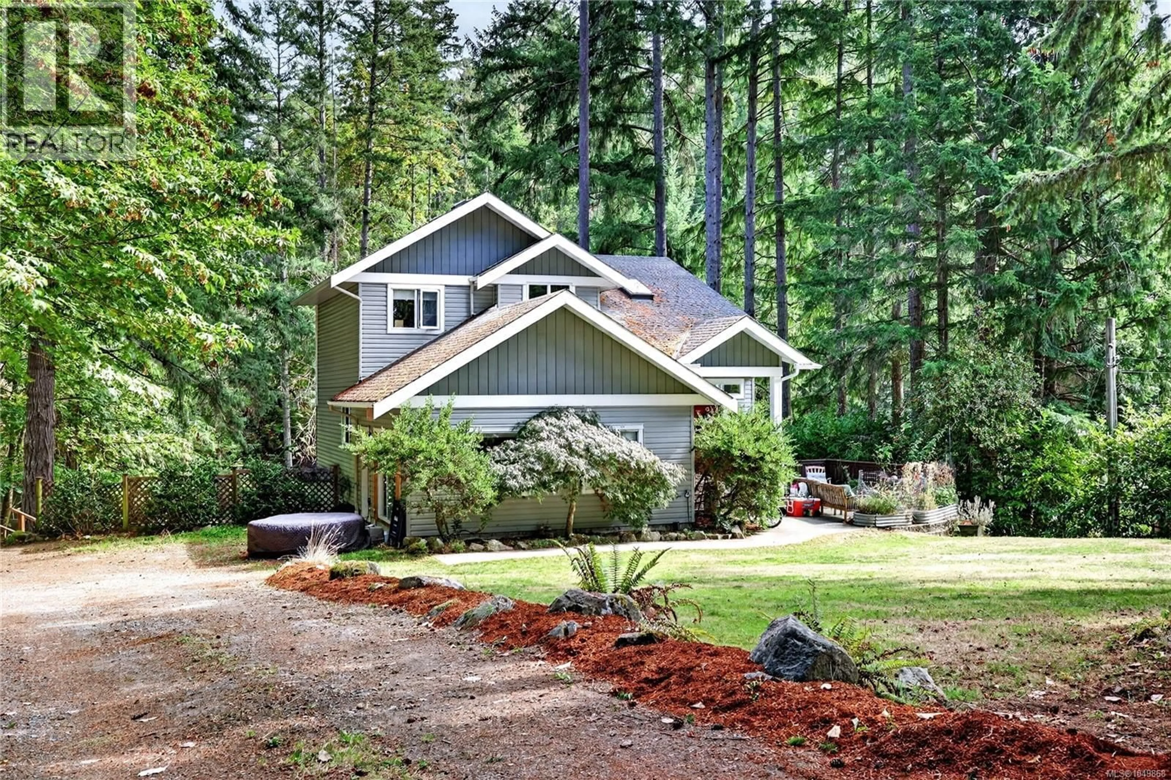 Home with vinyl exterior material, forest/trees view for 135 PINE PLACE, Salt Spring British Columbia V8K2N4
