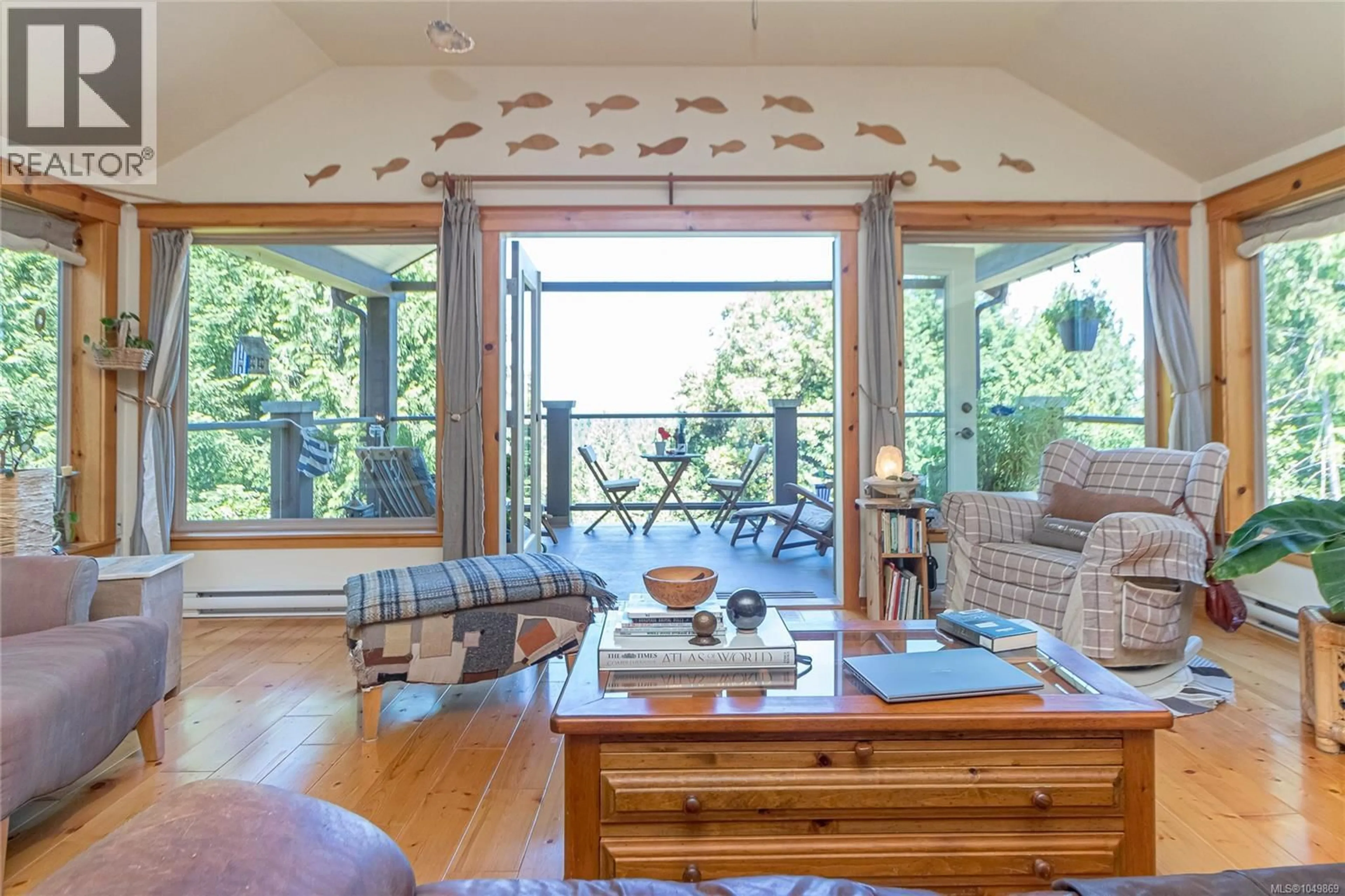 Living room with furniture, wood/laminate floor for 1860 ASHLING ROAD, Qualicum Beach British Columbia V9K2V1