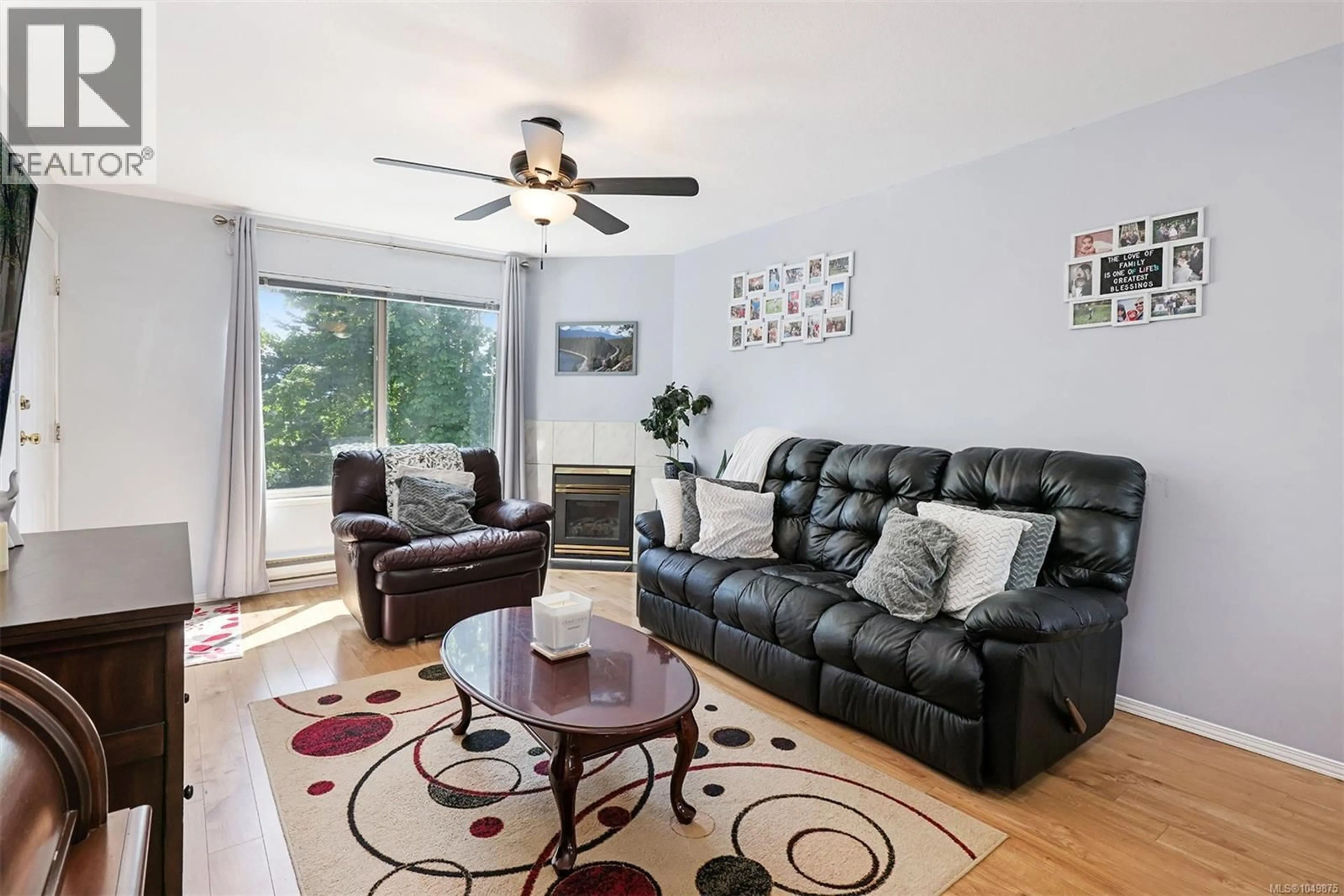 Living room with furniture, wood/laminate floor for 202 - 4685 ALDERWOOD PLACE, Courtenay British Columbia V9N9A1